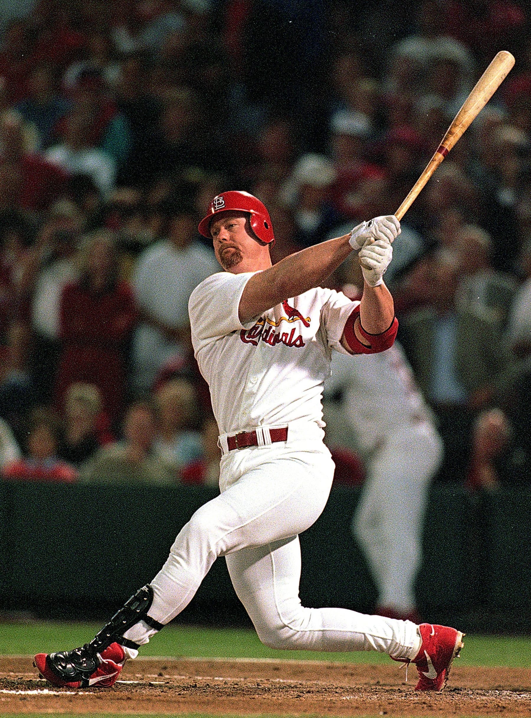 23 Sep 1998: (FILE PHOTO)  Mark McGwire #25 of the St. Louis Cardinals hits the ball during the game against the Houston Astros at Busch Stadium in St. Louis, Missouri. According to reports January 11, 2010, McGwire has admitted to steroid use during while playing Major League baseball and when he broke the home run record.  (Photo by Jonathan Daniel/Getty Images)