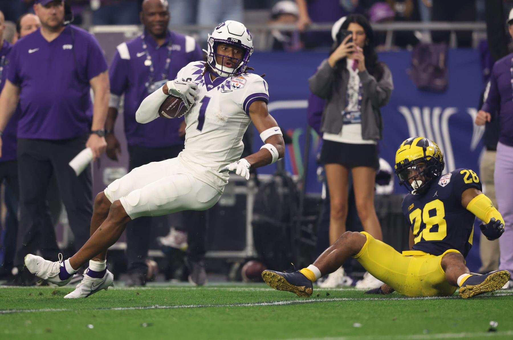 GLENDALE, ARIZONA - DECEMBER 31: Quentin Johnston #1 of the TCU Horned Frogs runs after catching a pass during the second quarter in the Vrbo Fiesta Bowl at State Farm Stadium on December 31, 2022 in Glendale, Arizona. (Photo by Christian Petersen/Getty Images)
