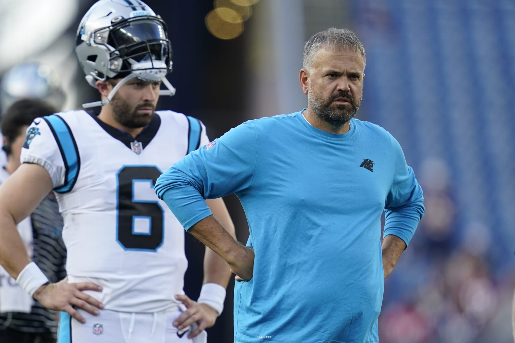 Carolina Panthers quarterback Baker Mayfield (6) and head coach Matt Rhule on the field prior to a preseason NFL football game against the New England Patriots, Friday, Aug. 19, 2022, in Foxborough, Mass. (AP Photo/Charles Krupa) Carolina Panthers quarterback Baker Mayfield (6) and head coach Matt Rhule on the field prior to a preseason NFL football game against the New England Patriots, Friday, Aug. 19, 2022, in Foxborough, Mass. (AP Photo/Charles Krupa)