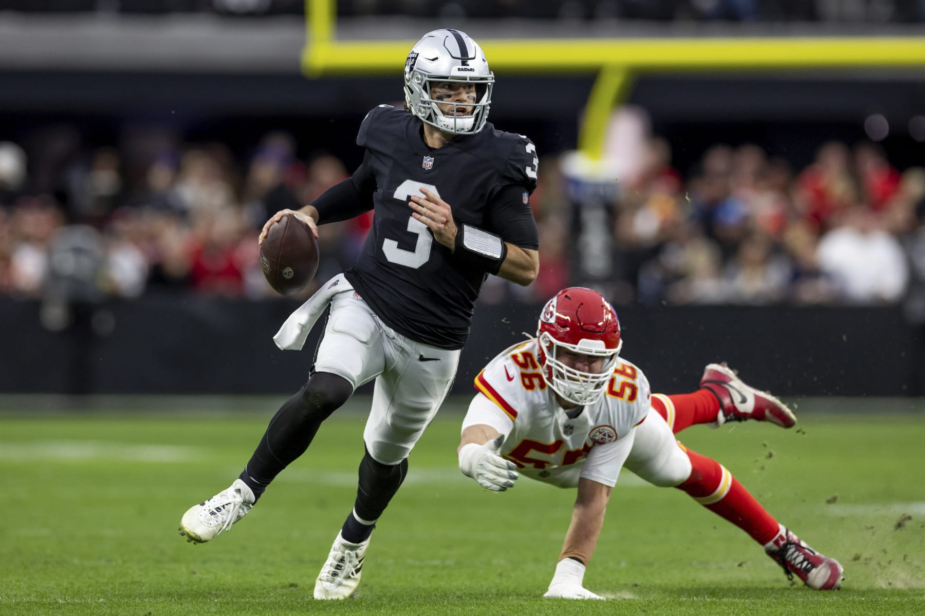 Las Vegas Raiders quarterback Jarrett Stidham (3) runs the ball against the Kansas City Chiefs in an NFL football game, Saturday, Jan. 7, 2023, in Las Vegas, NV. Chiefs defeated the Raiders 31-13. (AP Photo/Jeff Lewis)