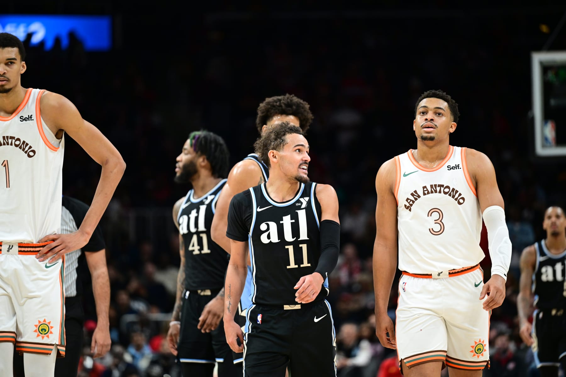 ATLANTA, GA - JANUARY 15: Trae Young #11 of the Atlanta Hawks smiles during the game against the San Antonio Spurs on January 15, 2024 at State Farm Arena in Atlanta, Georgia.  NOTE TO USER: User expressly acknowledges and agrees that, by downloading and/or using this Photograph, user is consenting to the terms and conditions of the Getty Images License Agreement. Mandatory Copyright Notice: Copyright 2024 NBAE (Photo by Adam Hagy/NBAE via Getty Images)