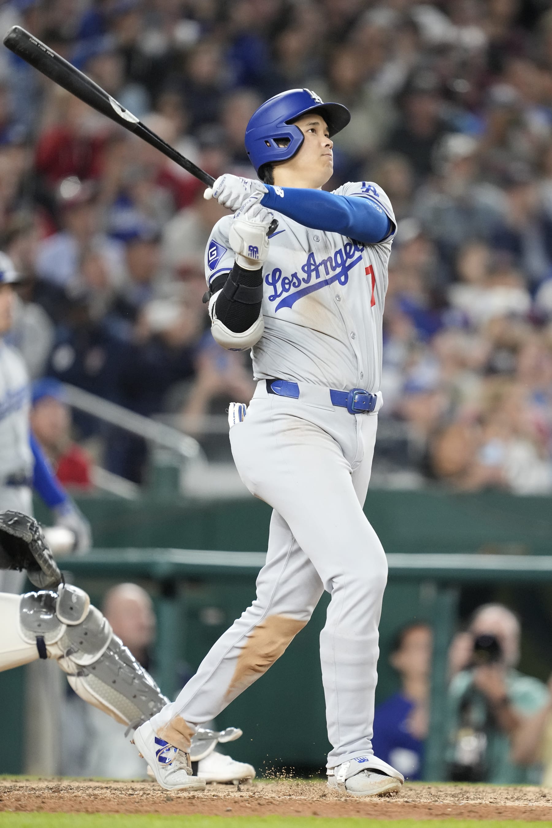 WASHINGTON, DC - APRIL 23:  Shohei Ohtani #17 of the Los Angeles Dodgers hits a solo home run in the ninth inning during a baseball game against the Washington Nationals at Nationals Park on April 23, 2024 in Washington, DC.  (Photo by Mitchell Layton/Getty Images)