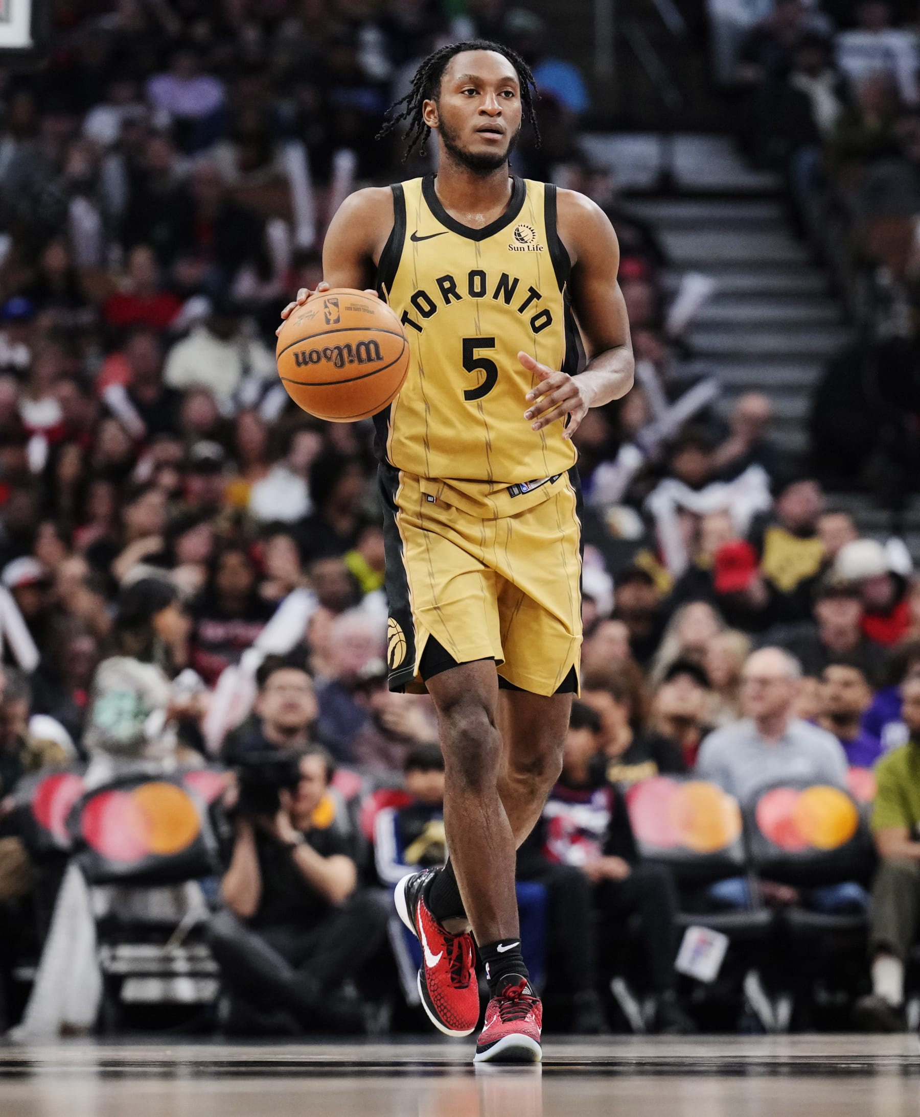 TORONTO, ON - APRIL 7: Immanuel Quickley #5 and Immanuel Quickley #5 of the Toronto Raptors dribbles against the Washington Wizards during the second half of their basketball game at the Scotiabank Arena on April 7, 2024 in Toronto, Ontario, Canada. NOTE TO USER: User expressly acknowledges and agrees that, by downloading and/or using this Photograph, user is consenting to the terms and conditions of the Getty Images License Agreement. (Photo by Mark Blinch/Getty Images)