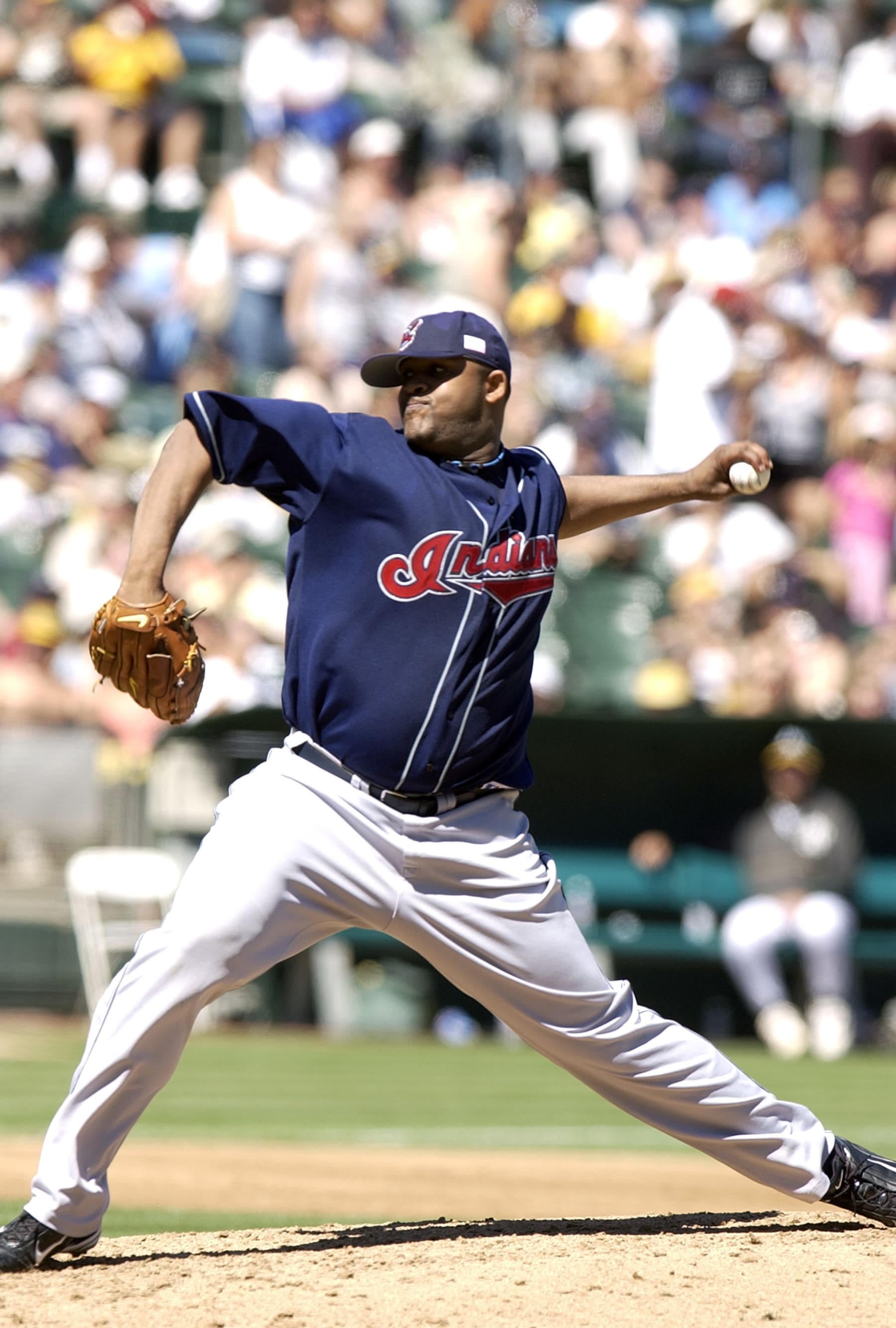 OAKLAND, CA - SEPTEMBER 11:  C.C. Sabathia #52 of the Cleveland Indians pitches against the Oakland Athletics during an Major League Baseball game September 11, 2004 at the Oakland-Alameda County Coliseum in Oakland, California.  Sabathia played for the Indians from 2001-2008. (Photo by Focus on Sport/Getty Images)