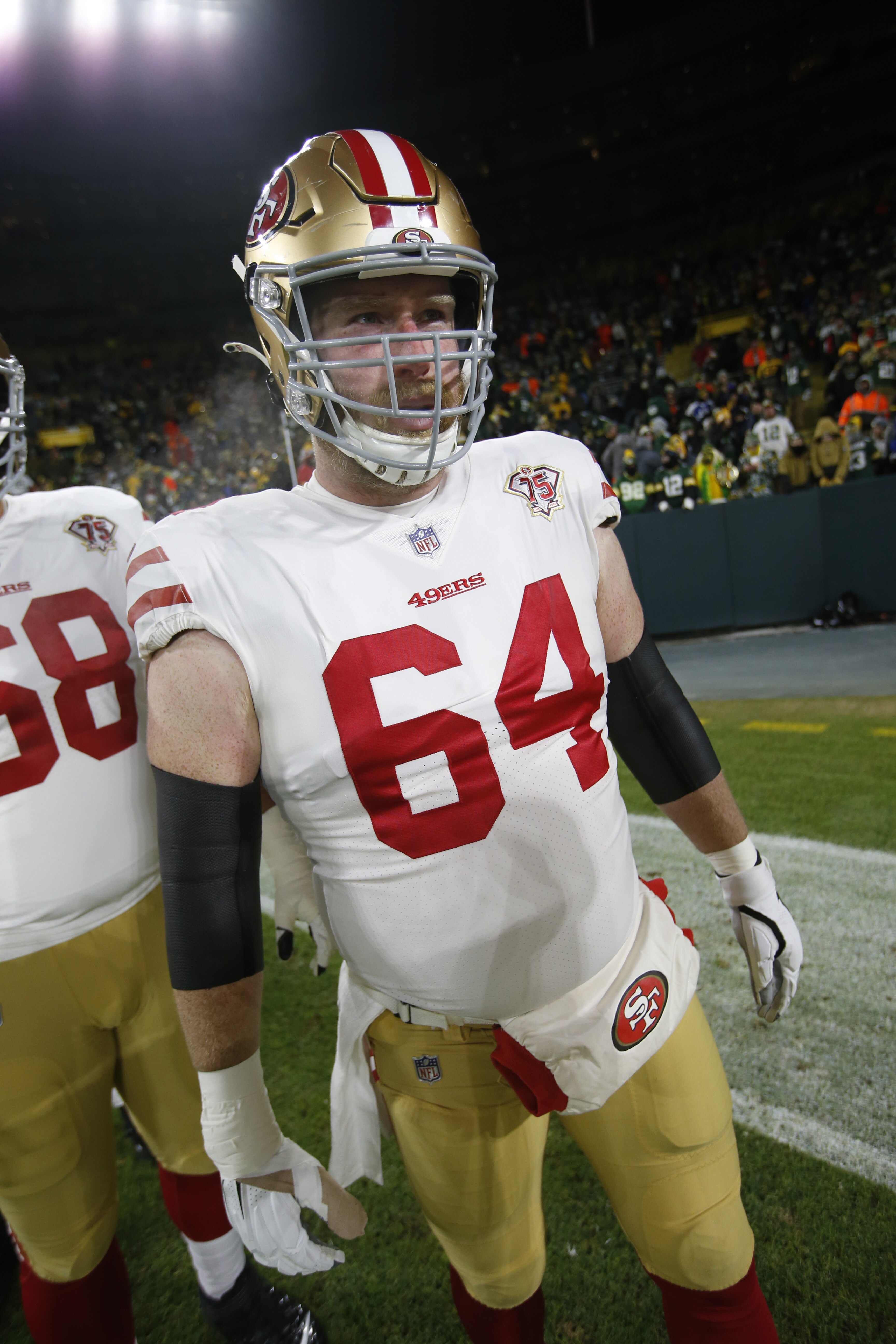 GREEN BAY, WISCONSIN - JANUARY 22: Jake Brendel #64 of the San Francisco 49ers on the field before the game against the Green Bay Packers in the NFC Divisional Playoff game at Lambeau Field on January 22, 2022 in Green Bay, Wisconsin. The 49ers defeated the Packers 13-10. (Photo by Michael Zagaris/San Francisco 49ers/Getty Images)