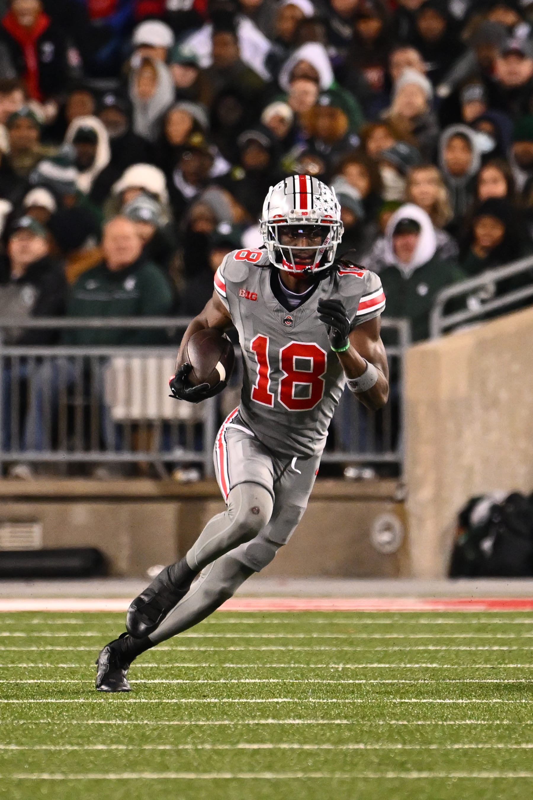 COLUMBUS, OHIO - NOVEMBER 11: Marvin Harrison Jr. #18 of the Ohio State Buckeyes runs with the ball during the second quarter of a game against the Michigan State Spartans at Ohio Stadium on November 11, 2023 in Columbus, Ohio. (Photo by Ben Jackson/Getty Images)