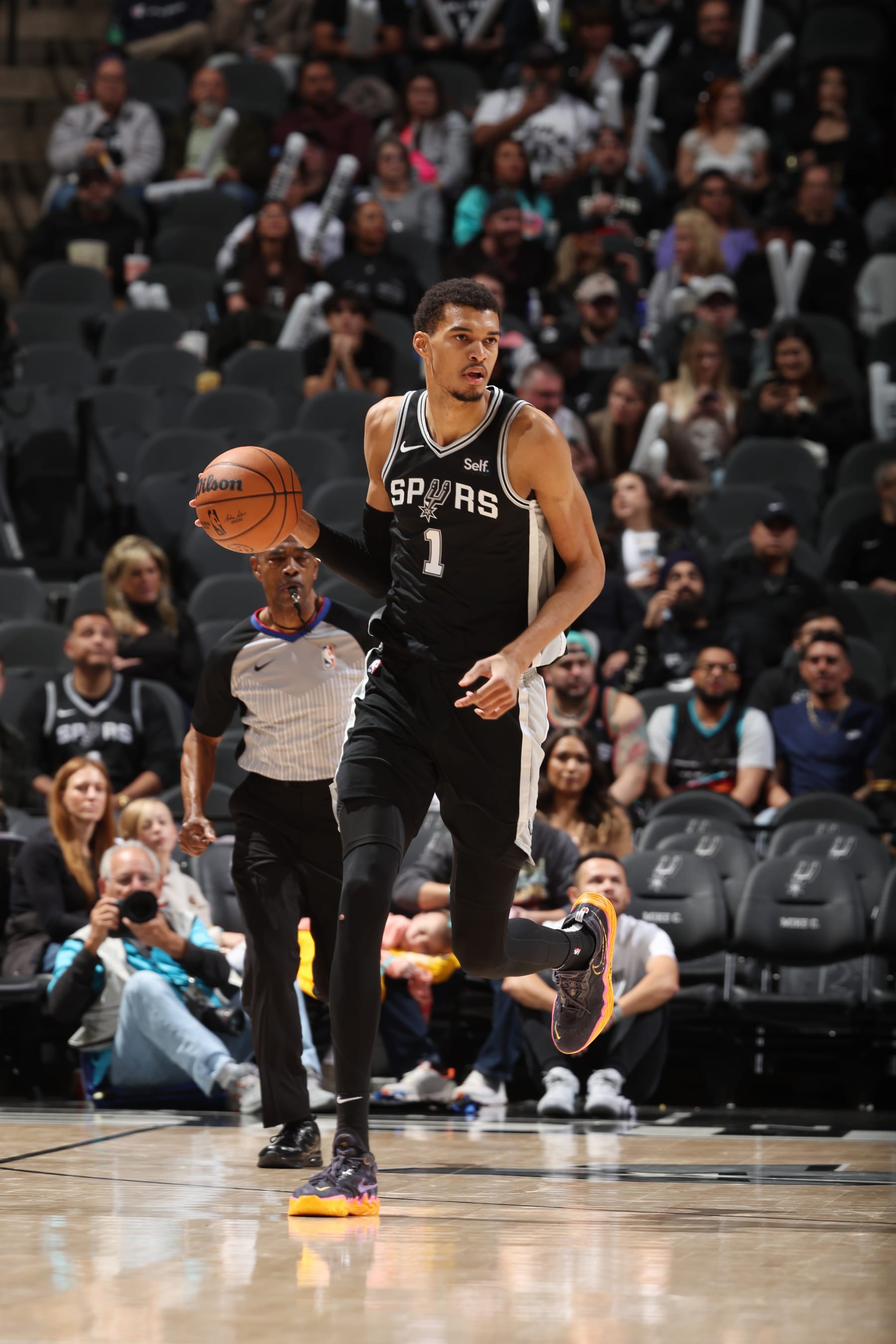 SAN ANTONIO, TX - JANUARY 26: Victor Wembanyama #1 of the San Antonio Spurs dribbles the ball during the game against the Portland Trail Blazers on January 6, 2024 at the Frost Bank Center in San Antonio, Texas. NOTE TO USER: User expressly acknowledges and agrees that, by downloading and or using this photograph, user is consenting to the terms and conditions of the Getty Images License Agreement. Mandatory Copyright Notice: Copyright 2024 NBAE (Photos by David Sherman/NBAE via Getty Images)