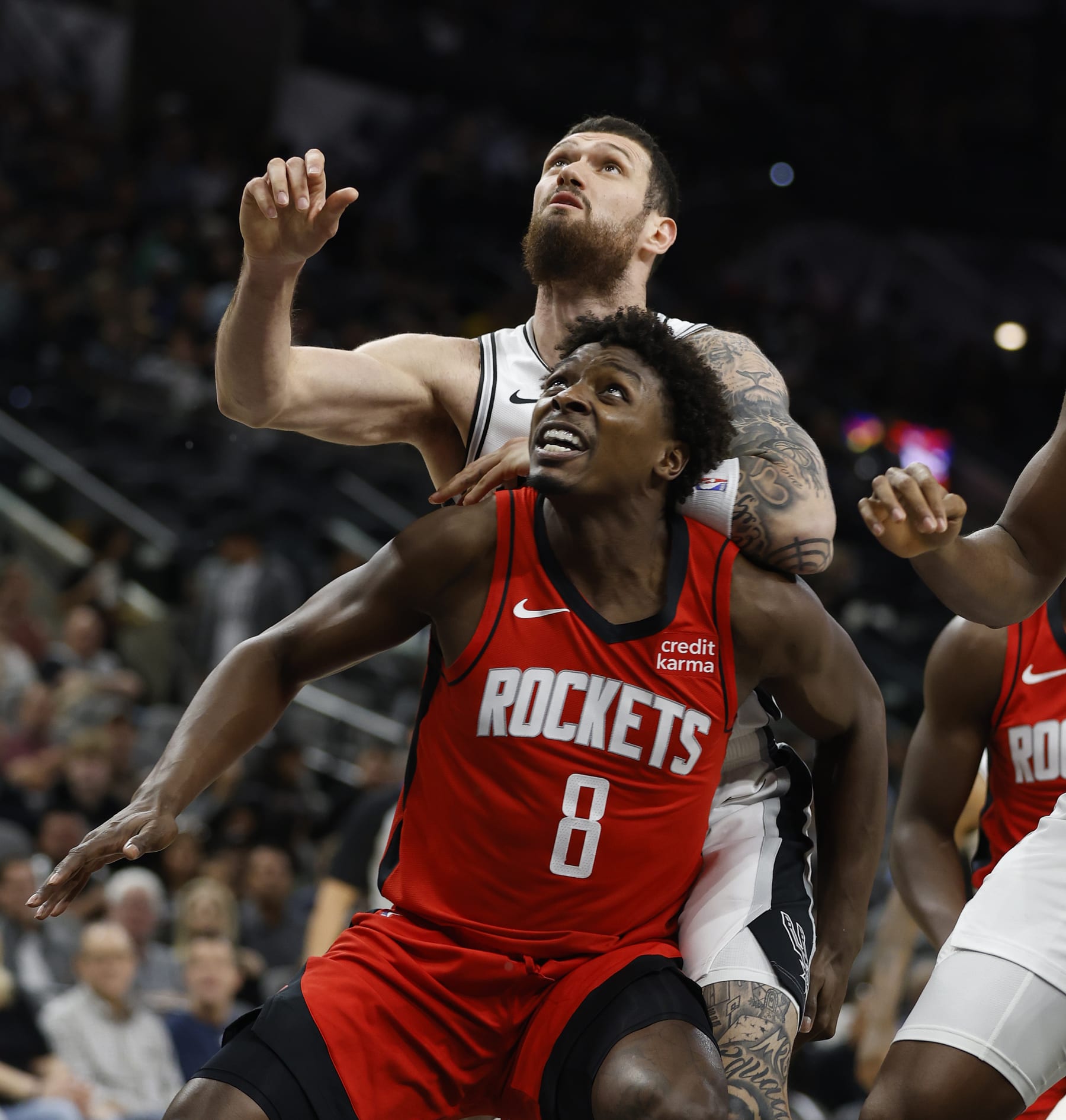 SAN ANTONIO, TX - OCTOBER 16: Jae'Sean Tate #8 of the Houston Rockets blocks out Sandro Mamukelashvili #54 of the San Antonio Spurs at Frost Bank Center on October 16, 2023 in San Antonio, Texas. NOTE TO USER: User expressly acknowledges and agrees that, by downloading and or using this photograph, User is consenting to terms and conditions of the Getty Images License Agreement. (Photo by Ronald Cortes/Getty Images)
