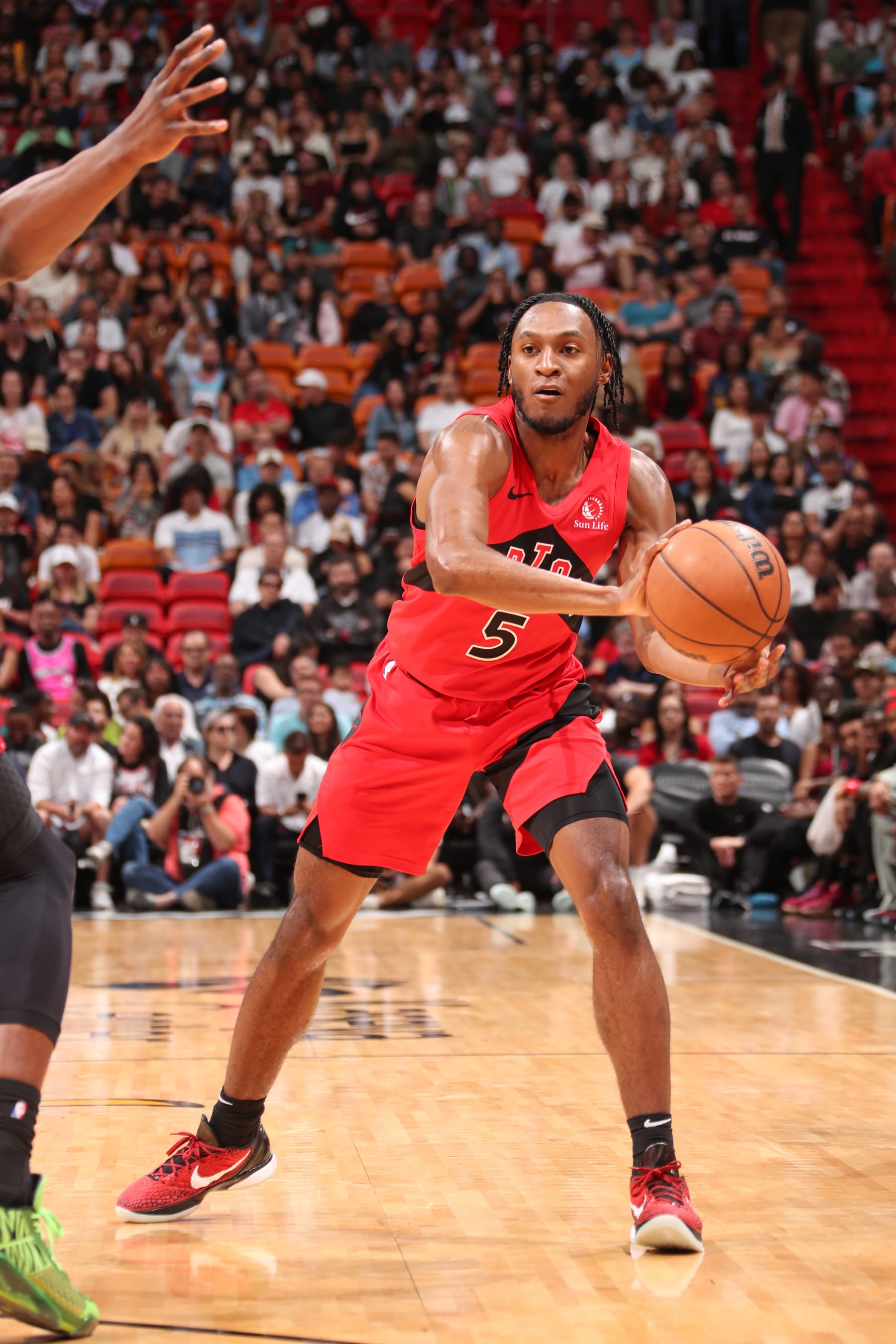 MIAMI, FL - APRIL 12:  Immanuel Quickley #5 of the Toronto Raptors looks to pass the ball during the game against the Miami Heat on April 12, 2024 at Kaseya Center in Miami, Florida. NOTE TO USER: User expressly acknowledges and agrees that, by downloading and or using this Photograph, user is consenting to the terms and conditions of the Getty Images License Agreement. Mandatory Copyright Notice: Copyright 2024 NBAE (Photo by Issac Baldizon/NBAE via Getty Images)