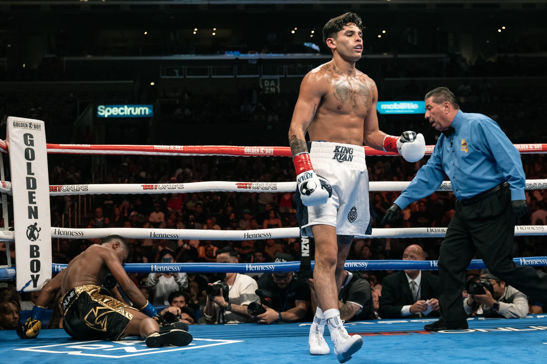 LOS ANGELES, CALIFORNIA - JULY 16: Ryan Garcia (R) knocks Javier Fortuna down during their Super Light weight 12 rounds fight at Crypto.com Arena on July 16, 2022 in Los Angeles, California. (Photo by Sye Williams/Getty Images)