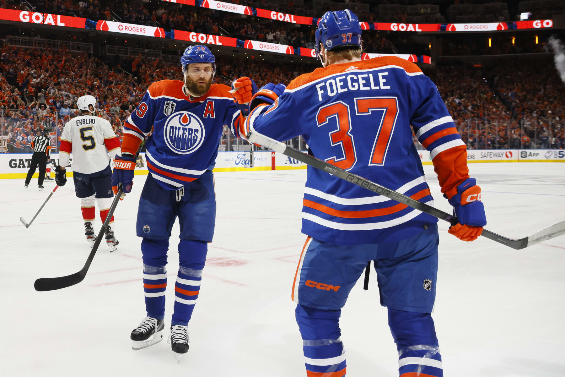 EDMONTON, ALBERTA - JUNE 21: Leon Draisaitl #29 and Warren Foegele #37 of the Edmonton Oilers celebrate after Foegele's goal during the first period of Game Six of the 2024 Stanley Cup Final against the Florida Panthers at Rogers Place on June 21, 2024 in Edmonton, Alberta.  (Photo by Bruce Bennett/Getty Images)
