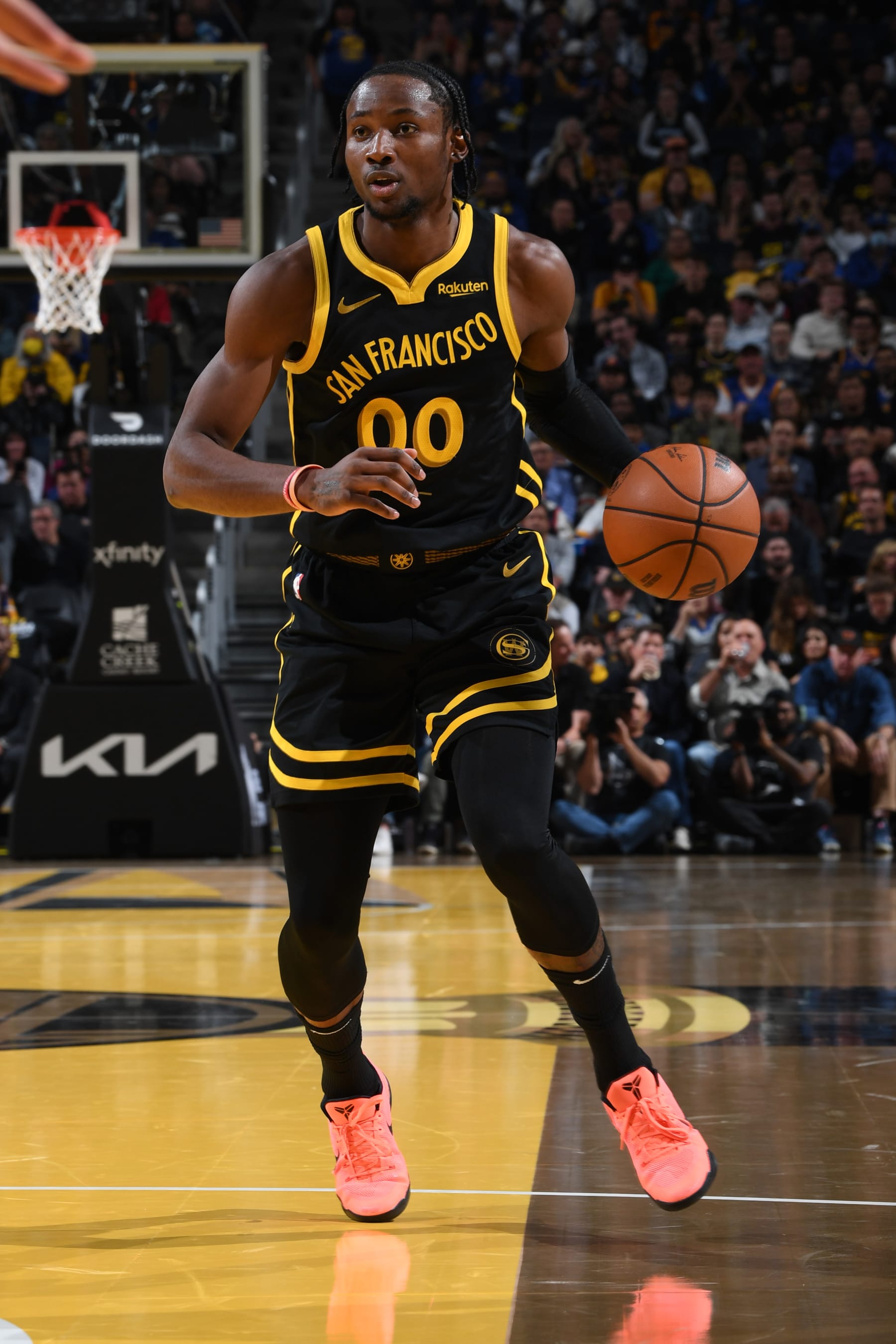 SAN FRANCISCO, CA - NOVEMBER 14: Jonathan Kuminga #00 of the Golden State Warriors dribbles the ball during the game against the Minnesota Timberwolves during the In-Season Tournament on November 14, 2023 at Chase Center in San Francisco, California. NOTE TO USER: User expressly acknowledges and agrees that, by downloading and or using this photograph, user is consenting to the terms and conditions of Getty Images License Agreement. Mandatory Copyright Notice: Copyright 2023 NBAE (Photo by Noah Graham/NBAE via Getty Images)