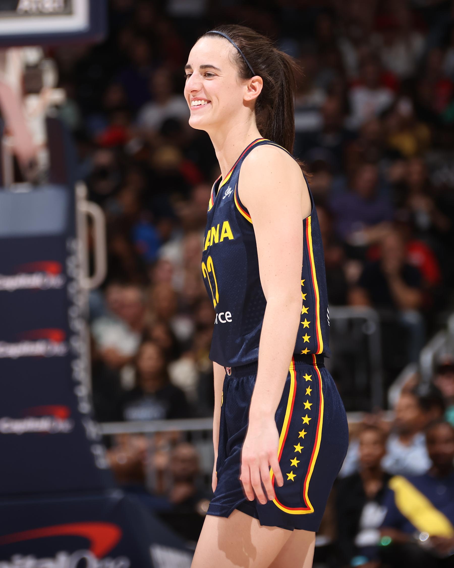 WASHINGTON, D.C. - SEPTEMBER 19: Caitlin Clark #22 of the Indiana Fever smiles during the game against the Washington Mystics on September 19, 2024 at Entertainment and Sports Arena in Washington, D.C. NOTE TO USER: User expressly acknowledges and agrees that, by downloading and or using this photograph, User is consenting to the terms and conditions of the Getty Images License Agreement. Mandatory Copyright Notice: Copyright 2024 NBAE (Photo by Kenny Giarla/NBAE via Getty Images)