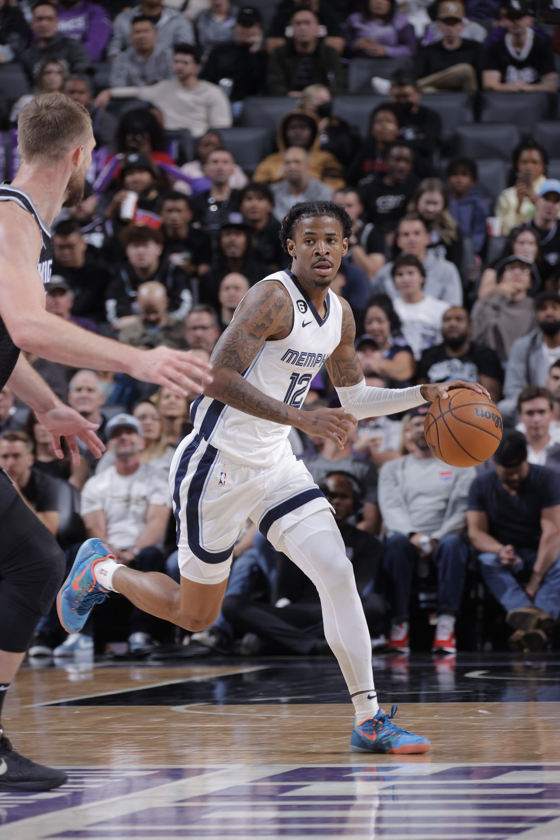 SACRAMENTO, CA - OCTOBER 27: Ja Morant #12 of the Memphis Grizzlies dribbles the ball during the game against the Sacramento Kings on October 27, 2022 at Golden 1 Center in Sacramento, California. NOTE TO USER: User expressly acknowledges and agrees that, by downloading and or using this Photograph, user is consenting to the terms and conditions of the Getty Images License Agreement. Mandatory Copyright Notice: Copyright 2022 NBAE (Photo by Rocky Widner/NBAE via Getty Images)