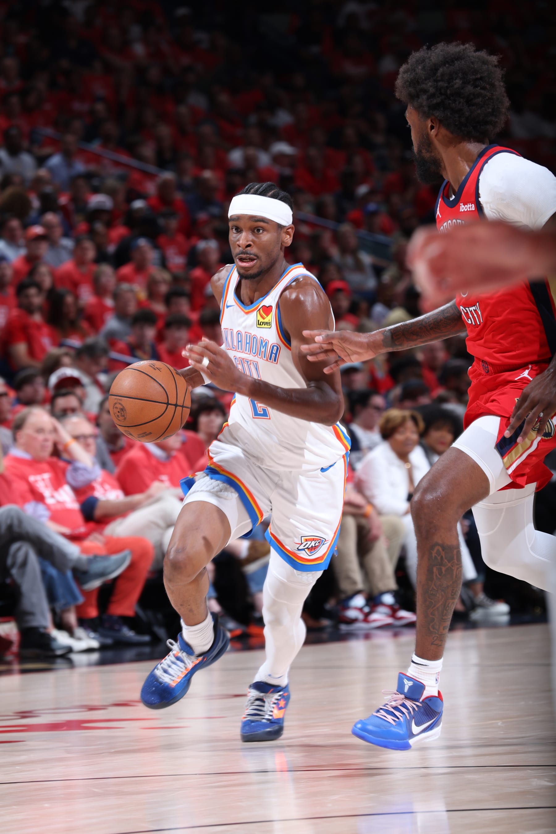 NEW ORLEANS, LA - APRIL 27:  Shai Gilgeous-Alexander #2 of the Oklahoma City Thunder handles the ball during the game against the New Orleans Pelicans during Round 1 Game 3 of the 2024 NBA Playoffs on April 27, 2024 at the Smoothie King Center in New Orleans, Louisiana. NOTE TO USER: User expressly acknowledges and agrees that, by downloading and or using this Photograph, user is consenting to the terms and conditions of the Getty Images License Agreement. Mandatory Copyright Notice: Copyright 2024 NBAE (Photo by Jeff Haynes/NBAE via Getty Images)