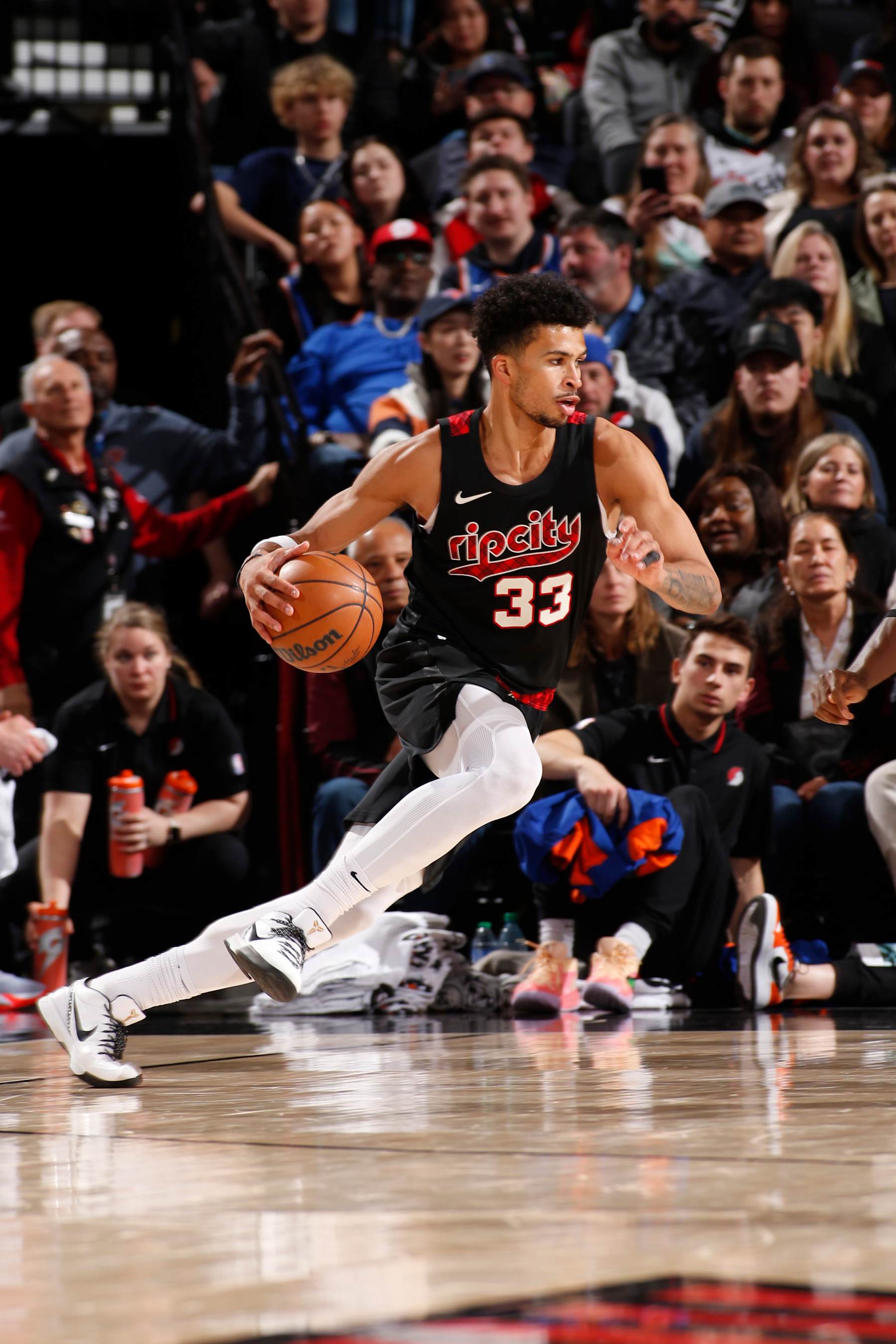 PORTLAND, OR - MARCH 14: Toumani Camara #33 of the Portland Trail Blazers dribbles the ball during the game against the New York Knicks on March 14, 2024 at the Moda Center Arena in Portland, Oregon. NOTE TO USER: User expressly acknowledges and agrees that, by downloading and or using this photograph, user is consenting to the terms and conditions of the Getty Images License Agreement. Mandatory Copyright Notice: Copyright 2024 NBAE (Photo by Cameron Browne/NBAE via Getty Images)