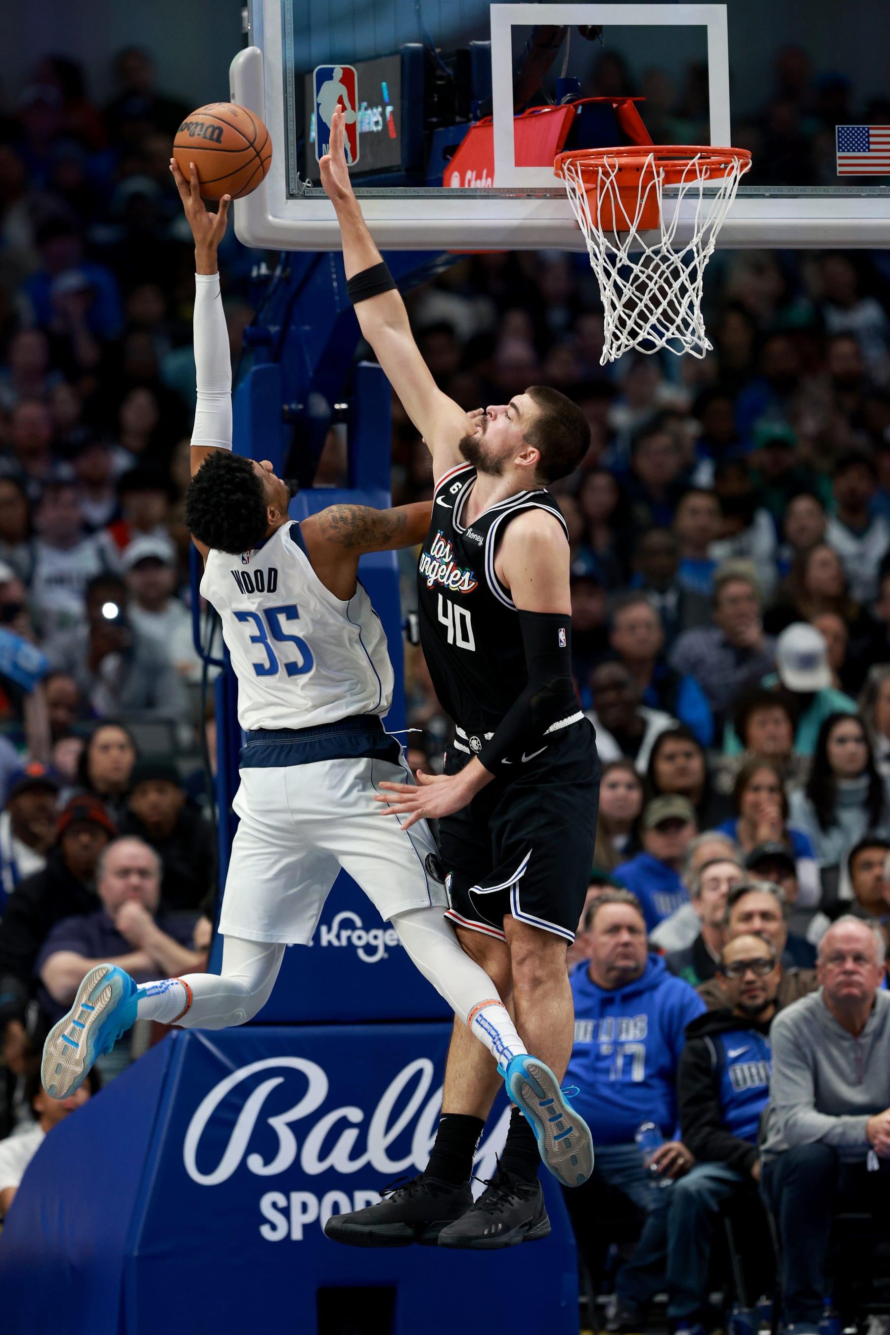 DALLAS, TEXAS - NOVEMBER 15: Ivica Zubac #40 of the LA Clippers blocks a shot against Christian Wood #35 of the Dallas Mavericks in the second half at American Airlines Center on November 15, 2022 in Dallas, Texas. NOTE TO USER: User expressly acknowledges and agrees that, by downloading and or using this photograph, User is consenting to the terms and conditions of the Getty Images License Agreement. (Photo by Tom Pennington/Getty Images)