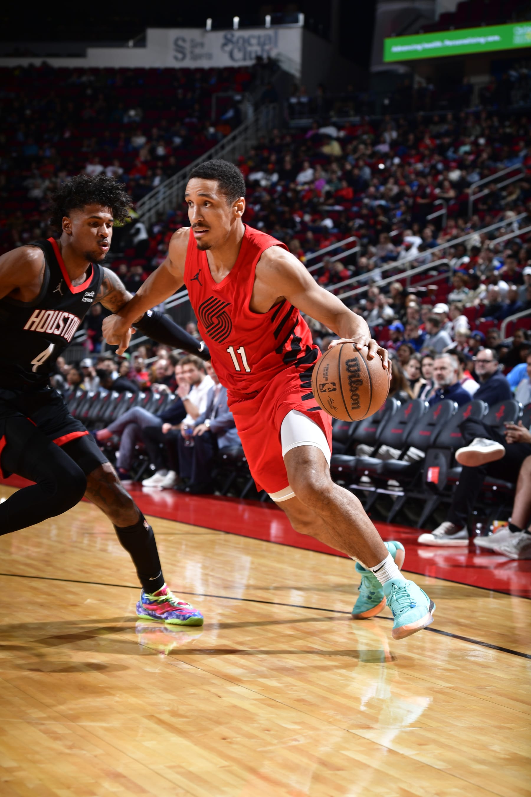 HOUSTON, TX - JANUARY 24: Malcolm Brogdon #11 of the Portland Trail Blazers drives to the basket during the game against the Houston Rockets on January 24, 2024 at the Toyota Center in Houston, Texas. NOTE TO USER: User expressly acknowledges and agrees that, by downloading and or using this photograph, User is consenting to the terms and conditions of the Getty Images License Agreement. Mandatory Copyright Notice: Copyright 2024 NBAE (Photo by Logan Riely/NBAE via Getty Images)