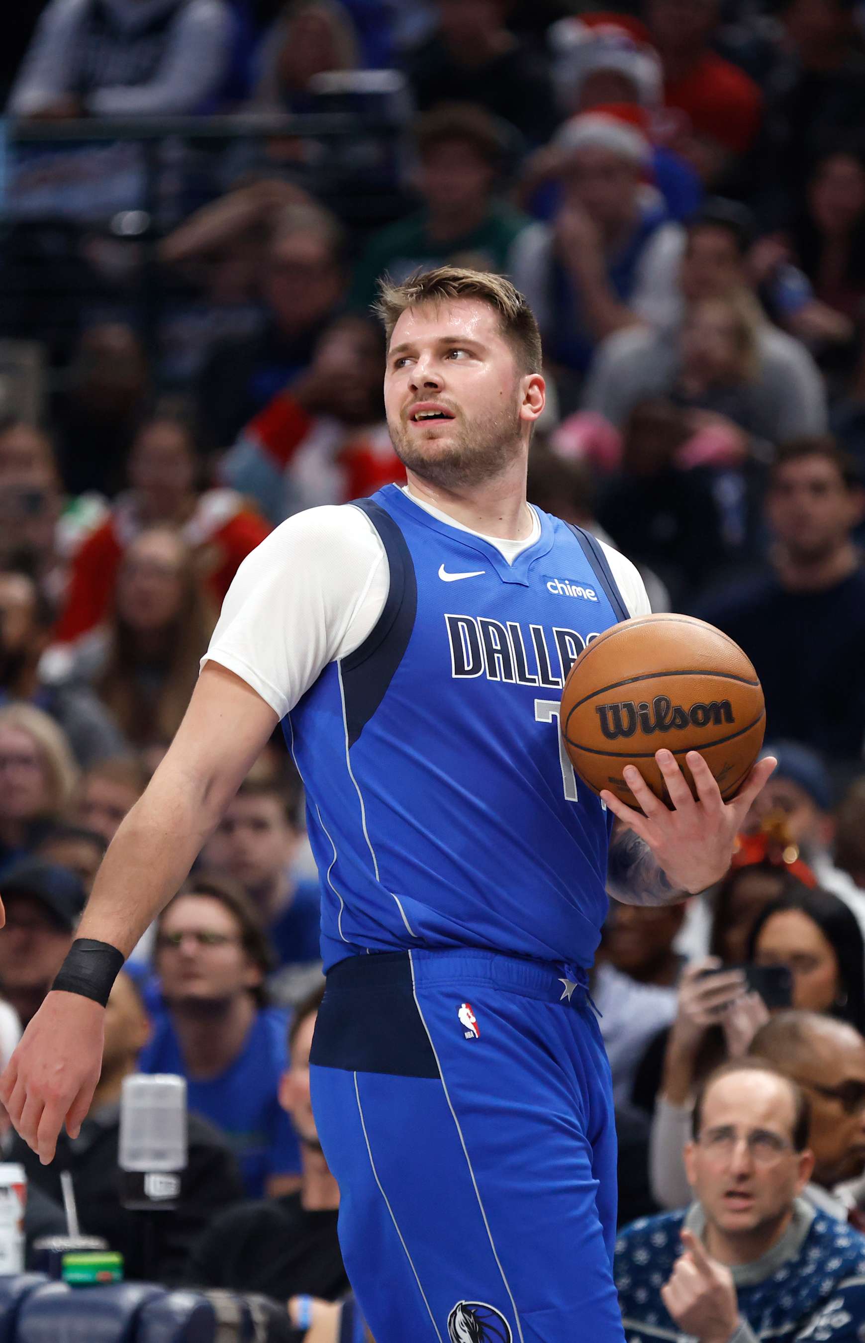 DALLAS, TX -DECEMBER 25 : Luka Doncic #77 of the Dallas Mavericks looks on against the Minnesota Timberwolves in the first half at American Airlines Center on December 25, 2024 in Dallas, Texas. NOTE TO USER: User expressly acknowledges and agrees that, by downloading and or using this photograph, User is consenting to the terms and conditions of the Getty Images License Agreement. (Photo by Ron Jenkins/Getty Images)