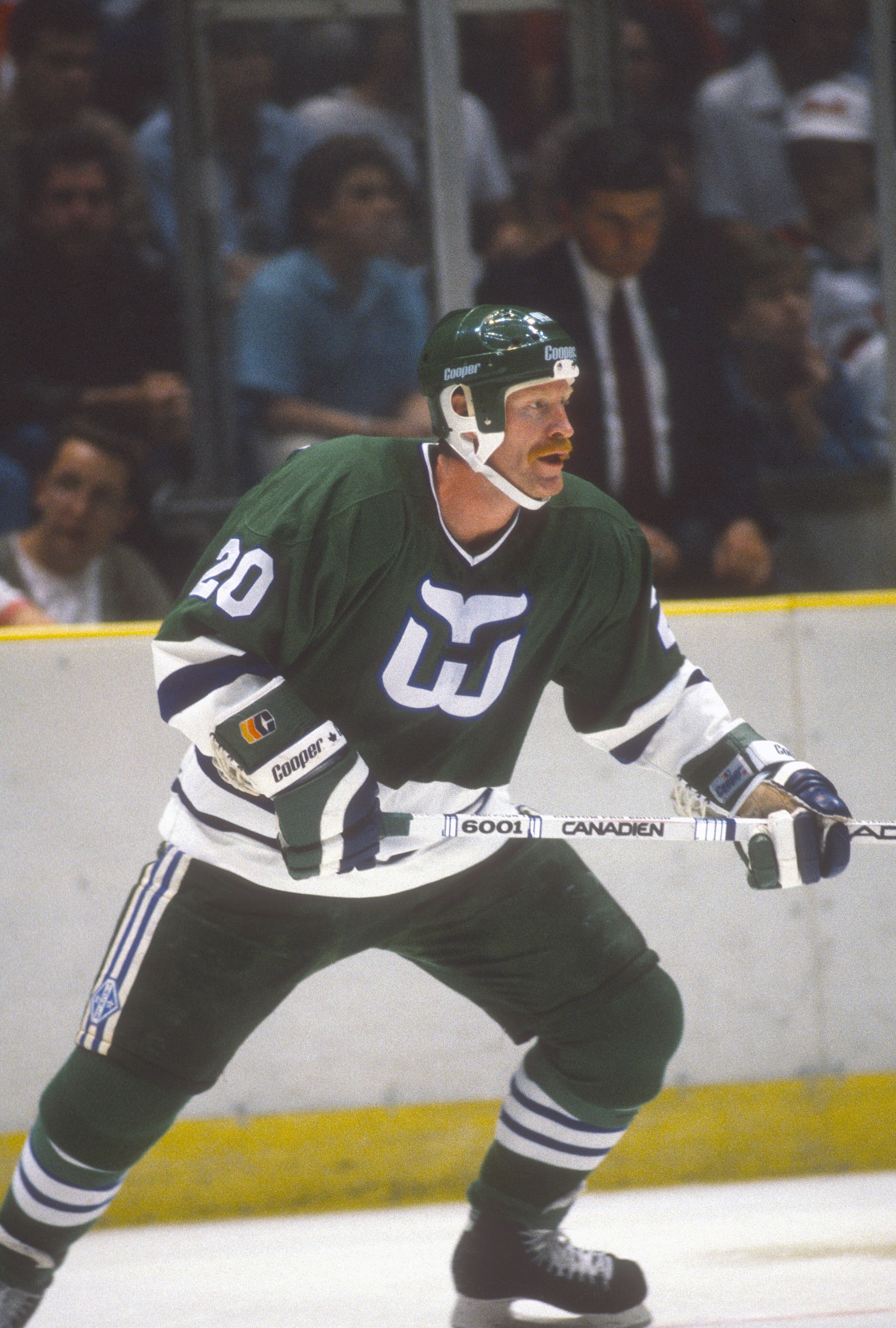 EAST RUTHERFORD, NJ - CIRCA 1988: John Anderson #20 of the Hartford Whalers skates against the New Jersey Devils during an NHL Hockey game circa 1988 at the Brendan Byrne Arena in East Rutherford, New Jersey. Anderson's playing career went from 1977-94. (Photo by Focus on Sport/Getty Images)