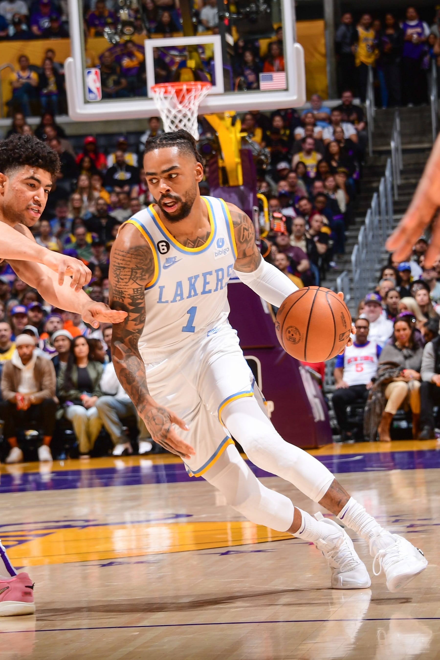 LOS ANGELES, CA - MARCH 12:  D'Angelo Russell #1 of the Los Angeles Lakers goes to the basket during the game on March 12, 2023 at Crypto.Com Arena in Los Angeles, California. NOTE TO USER: User expressly acknowledges and agrees that, by downloading and/or using this Photograph, user is consenting to the terms and conditions of the Getty Images License Agreement. Mandatory Copyright Notice: Copyright 2023 NBAE (Photo by Adam Pantozzi/NBAE via Getty Images)