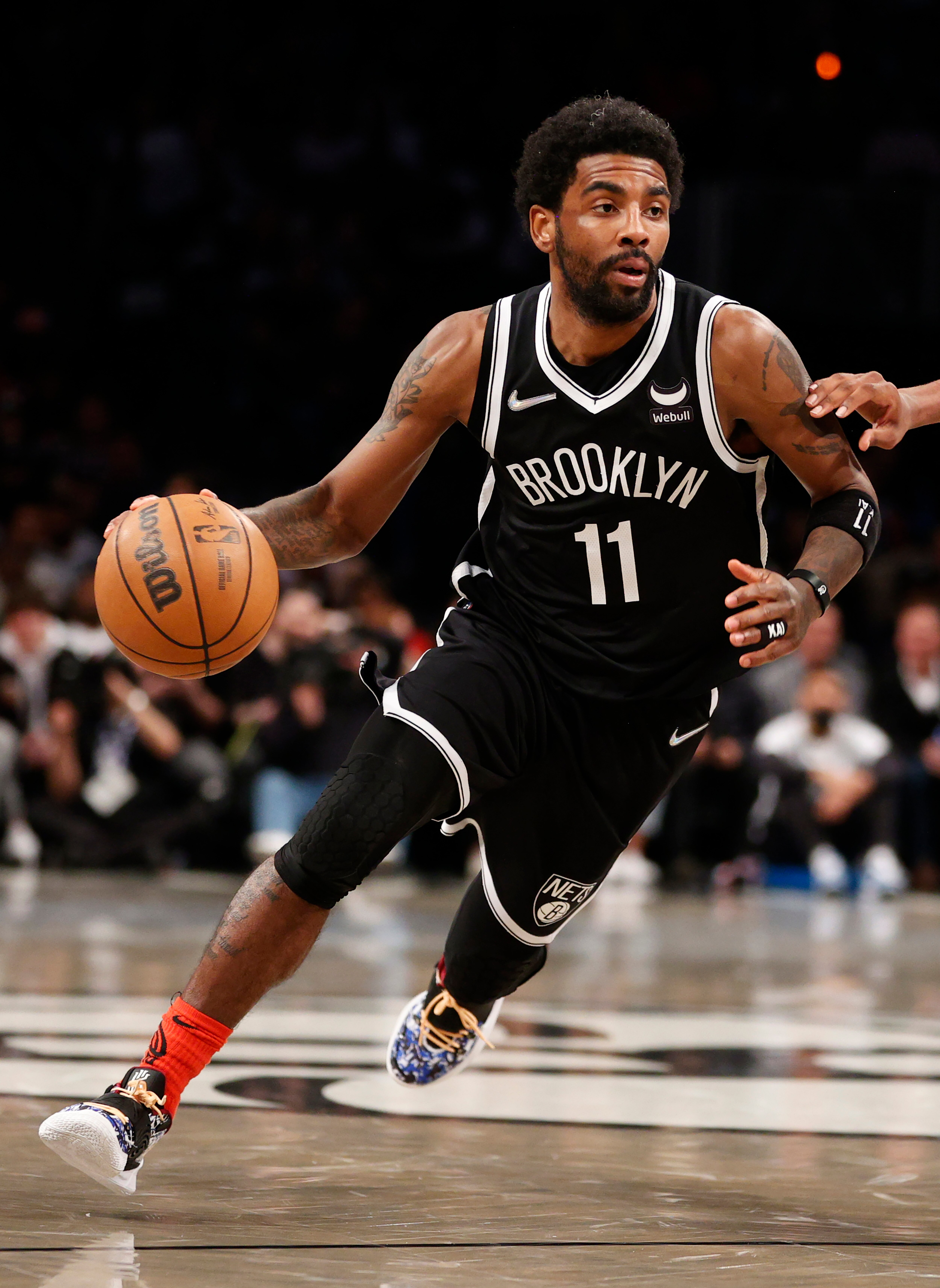 NEW YORK, NEW YORK - APRIL 12: Kyrie Irving #11 of the Brooklyn Nets dribbles during the first half of the Eastern Conference 2022 Play-In Tournament against the Cleveland Cavaliers at Barclays Center on April 12, 2022 in the Brooklyn borough of New York City. NOTE TO USER: User expressly acknowledges and agrees that, by downloading and or using this photograph, User is consenting to the terms and conditions of the Getty Images License Agreement. (Photo by Sarah Stier/Getty Images)
