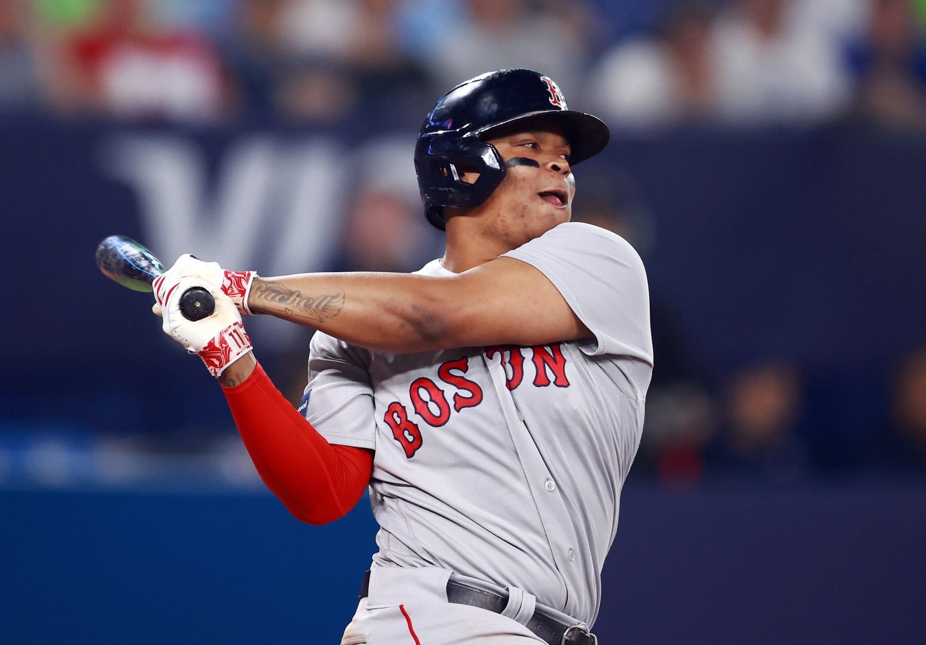 TORONTO, ON - JUNE 30:  Rafael Devers #11 of the Boston Red Sox bats in the fifth inning against the Toronto Blue Jays at Rogers Centre on June 30, 2023 in Toronto, Ontario, Canada.  (Photo by Vaughn Ridley/Getty Images)