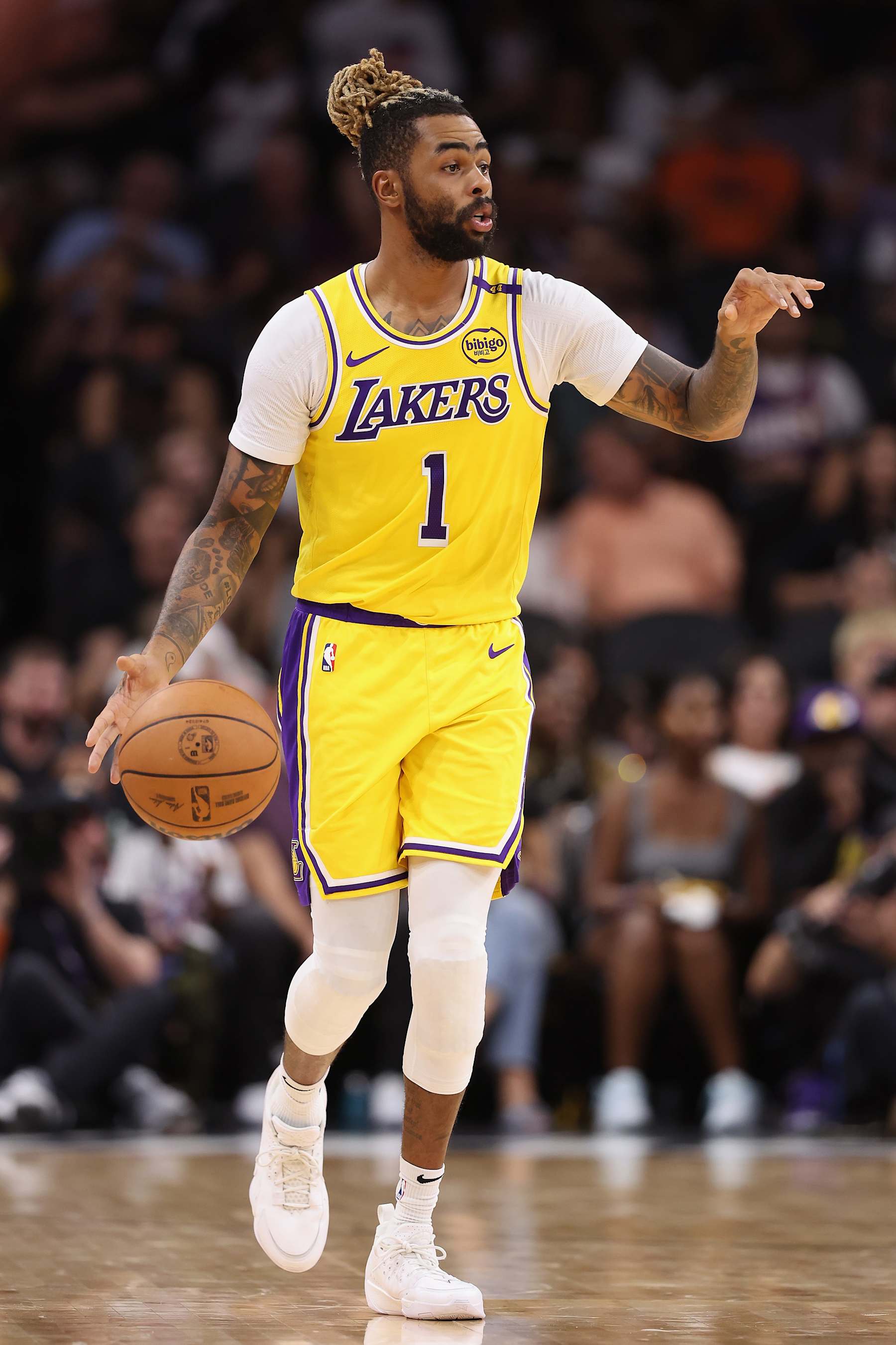 PHOENIX, ARIZONA - OCTOBER 17: D'Angelo Russell #1 of the Los Angeles Lakers handles the ball during the preseason NBA game at Footprint Center on October 17, 2024 in Phoenix, Arizona. The Lakers defeated the Suns 128-122. NOTE TO USER: User expressly acknowledges and agrees that, by downloading and/or using this photograph, user is consenting to the terms and conditions of the Getty Images License Agreement.  (Photo by Christian Petersen/Getty Images)