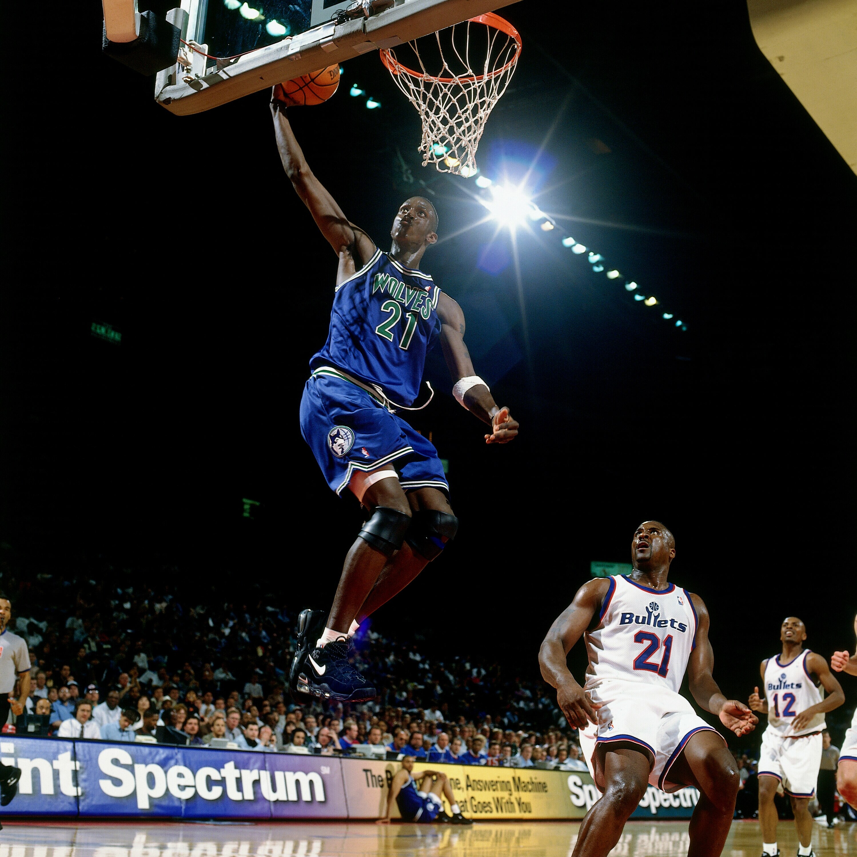 LANDOVER, MD - APRIL12:  Kevin Garnett #21 of the Minnesota Timberwolves drives to the basket for a layup against the Washington Bullets during an NBA game at the Capital Center on April 12, 1996 in Landover, Maryland. The Bullets defeated the Timberwolves 116-106.  NOTE TO USER: User expressly acknowledges that, by downloading and or using this photograph, User is consenting to the terms and conditions of the Getty Images License agreement. Mandatory Copyright Notice: Copyright 1996 NBAE (Photo by Barry Gossage/NBAE via Getty Images)