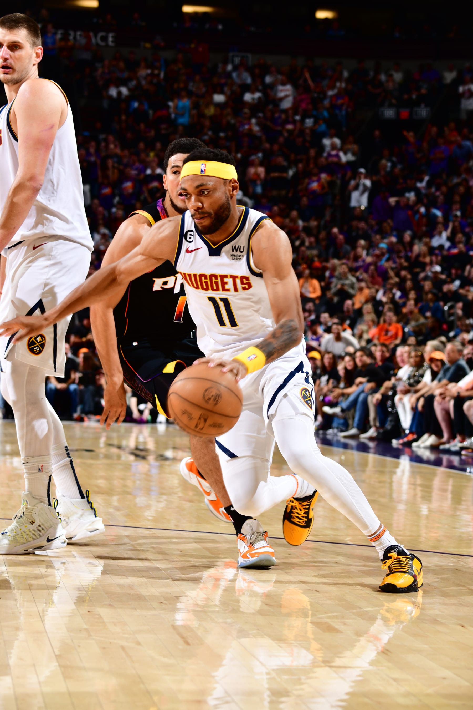 PHOENIX, AZ - MAY 7:  Bruce Brown #11 of the Denver Nuggets goes to the basket during the game during round two game four of the 2023 NBA Playoffs on May 7, 2023 at Footprint Center in Phoenix, Arizona. NOTE TO USER: User expressly acknowledges and agrees that, by downloading and or using this photograph, user is consenting to the terms and conditions of the Getty Images License Agreement. Mandatory Copyright Notice: Copyright 2022 NBAE (Photo by Barry Gossage/NBAE via Getty Images)