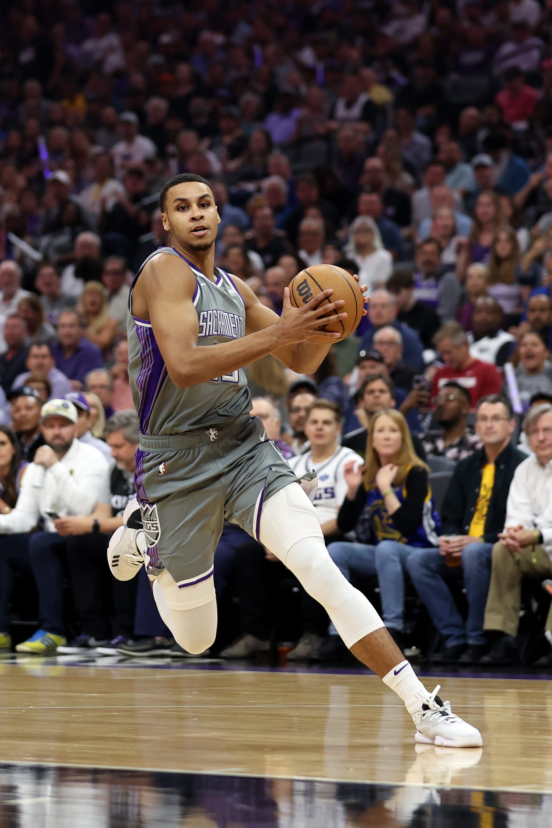 SACRAMENTO, CALIFORNIA - APRIL 26: Keegan Murray #13 of the Sacramento Kings dribbles the ball against the Golden State Warriors during Game Five of the Western Conference First Round Playoffs at Golden 1 Center on April 26, 2023 in Sacramento, California. NOTE TO USER: User expressly acknowledges and agrees that, by downloading and or using this photograph, User is consenting to the terms and conditions of the Getty Images License Agreement. (Photo by Ezra Shaw/Getty Images)