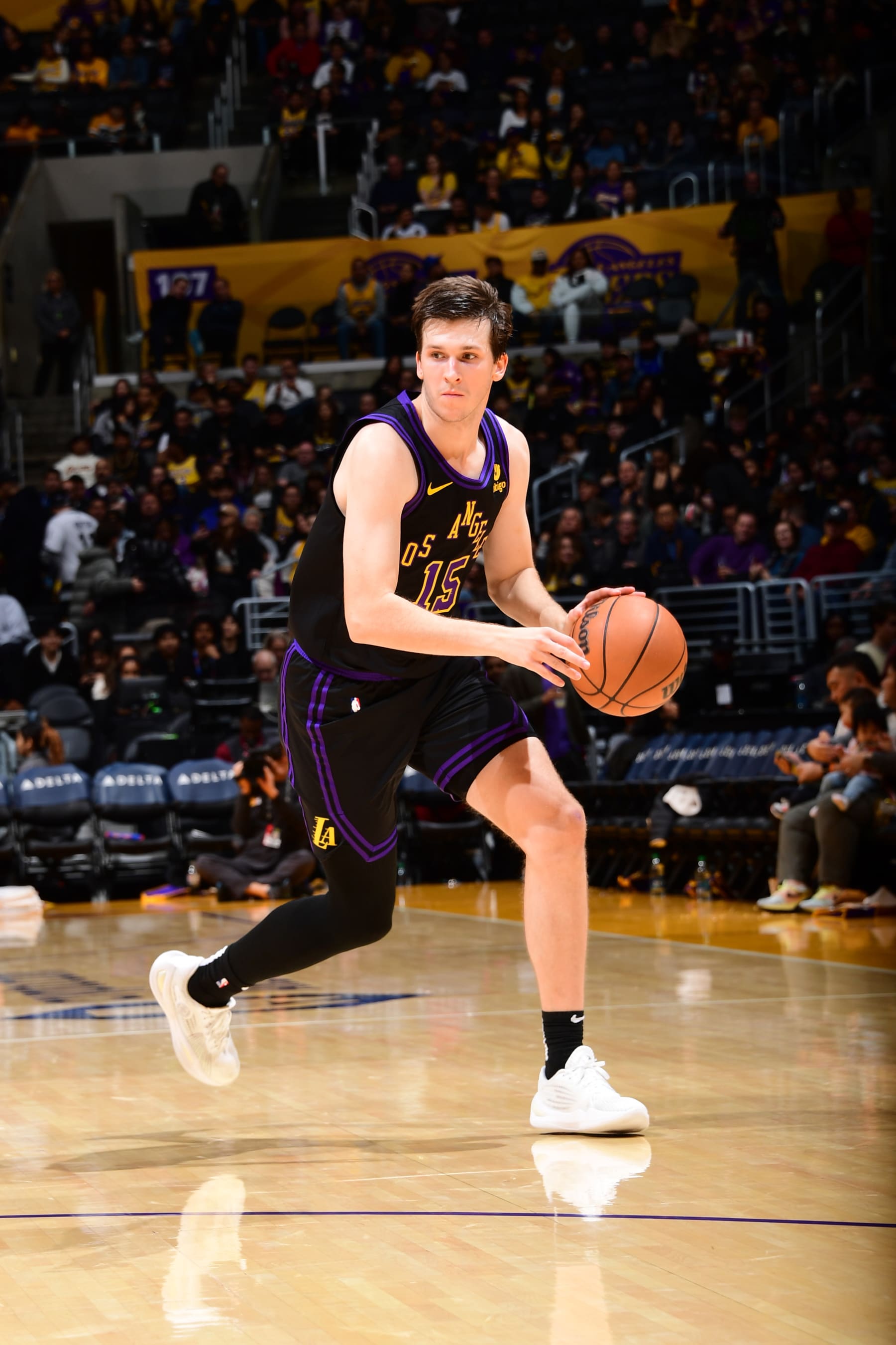 LOS ANGELES, CA - JANUARY 9: Austin Reaves #15 of the Los Angeles Lakers dribbles the ball during the game against the Toronto Raptors on January 9, 2024 at Crypto.Com Arena in Los Angeles, California. NOTE TO USER: User expressly acknowledges and agrees that, by downloading and/or using this Photograph, user is consenting to the terms and conditions of the Getty Images License Agreement. Mandatory Copyright Notice: Copyright 2024 NBAE (Photo by Adam Pantozzi/NBAE via Getty Images)