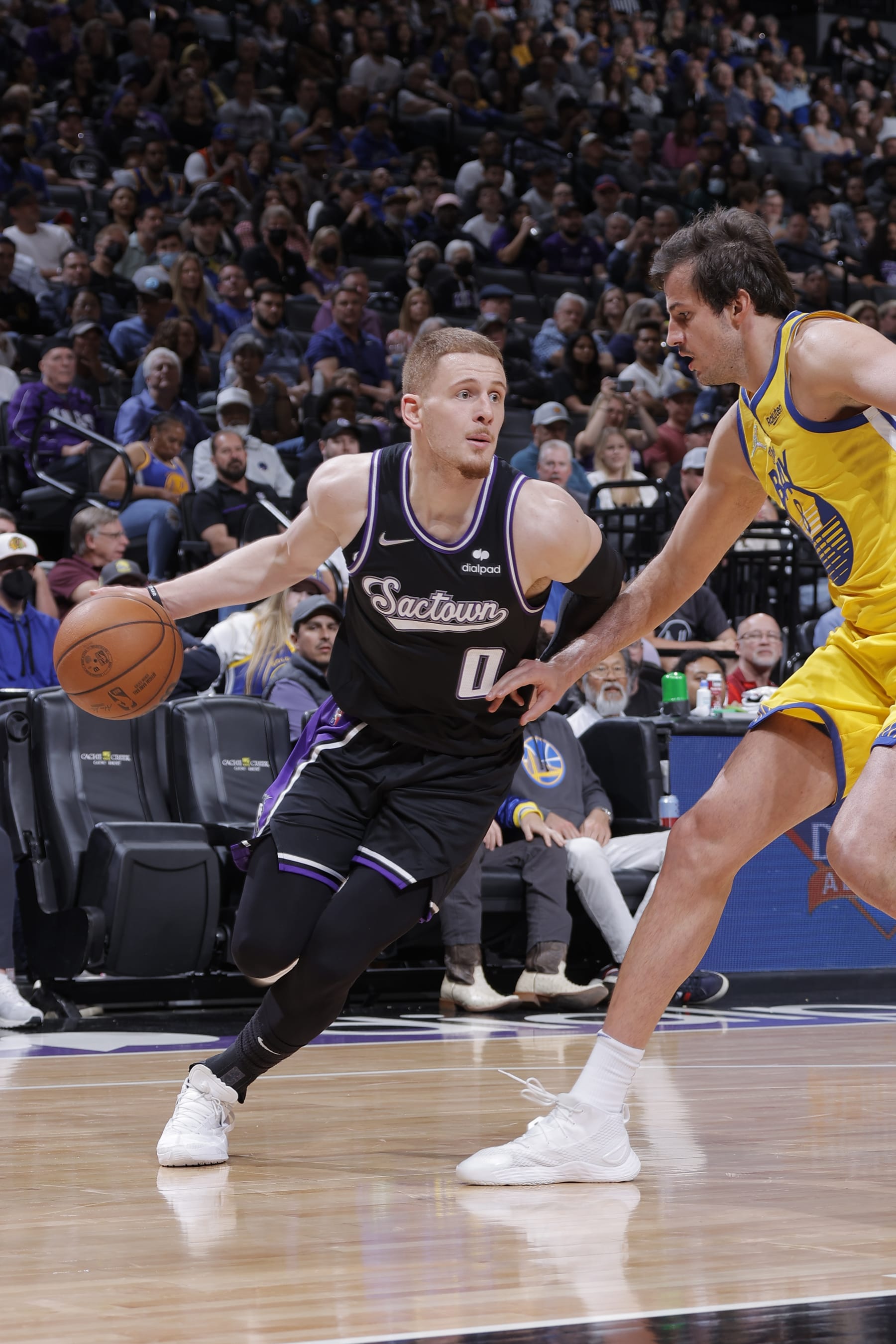 SACRAMENTO, CA - APRIL 3: Donte DiVincenzo #0 of the Sacramento Kings drives to the basket during the game against the Golden State Warriors on April 3, 2022 at Golden 1 Center in Sacramento, California. NOTE TO USER: User expressly acknowledges and agrees that, by downloading and or using this Photograph, user is consenting to the terms and conditions of the Getty Images License Agreement. Mandatory Copyright Notice: Copyright 2022 NBAE (Photo by Rocky Widner/NBAE via Getty Images)