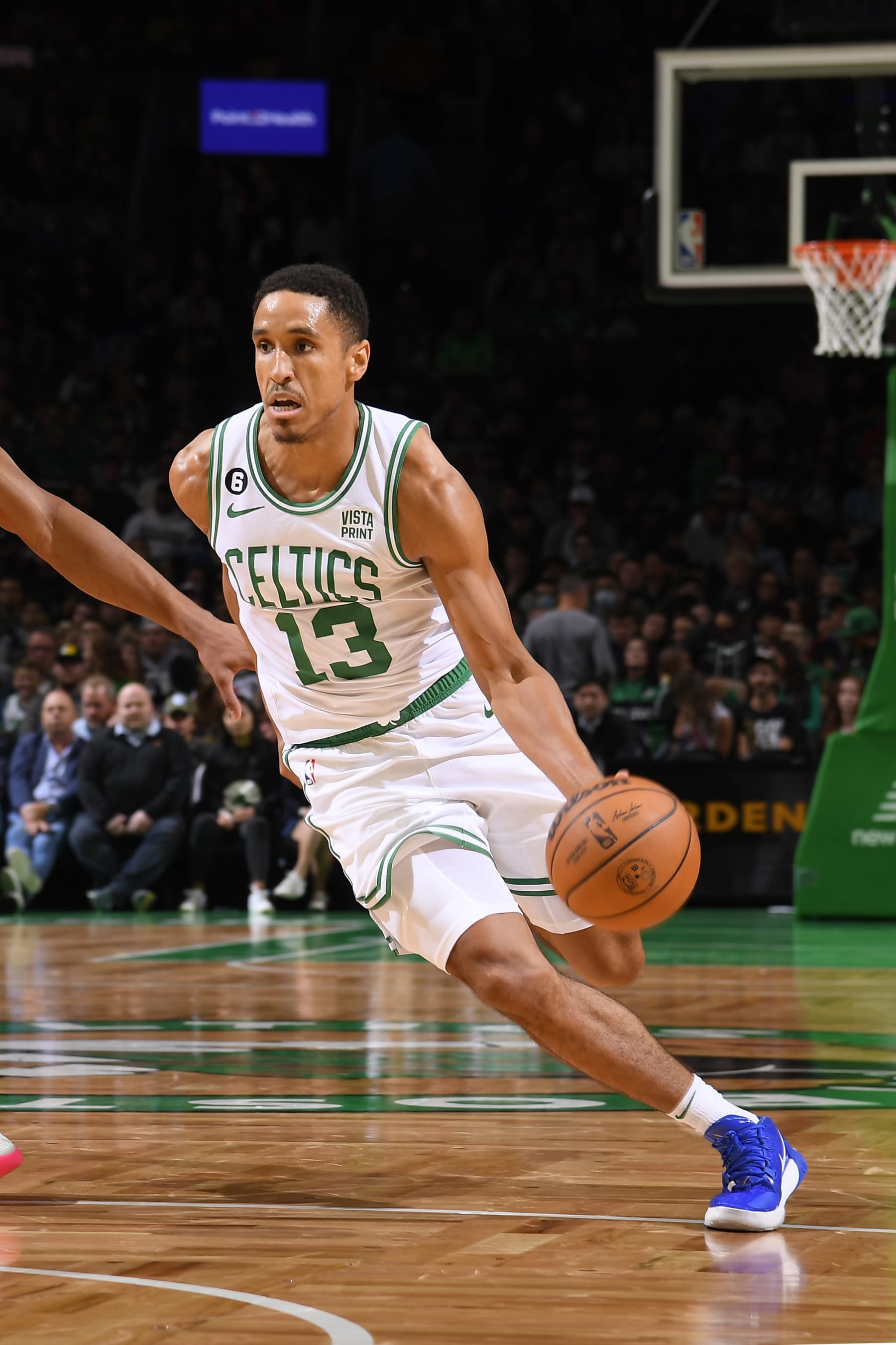 BOSTON, MA - OCTOBER 5: Malcolm Brogdon #13 of the Boston Celtics drives to the basket during the game against the Toronto Raptors on October 5, 2022 at the TD Garden in Boston, Massachusetts.  NOTE TO USER: User expressly acknowledges and agrees that, by downloading and or using this photograph, User is consenting to the terms and conditions of the Getty Images License Agreement. Mandatory Copyright Notice: Copyright 2022 NBAE  (Photo by Brian Babineau/NBAE via Getty Images)