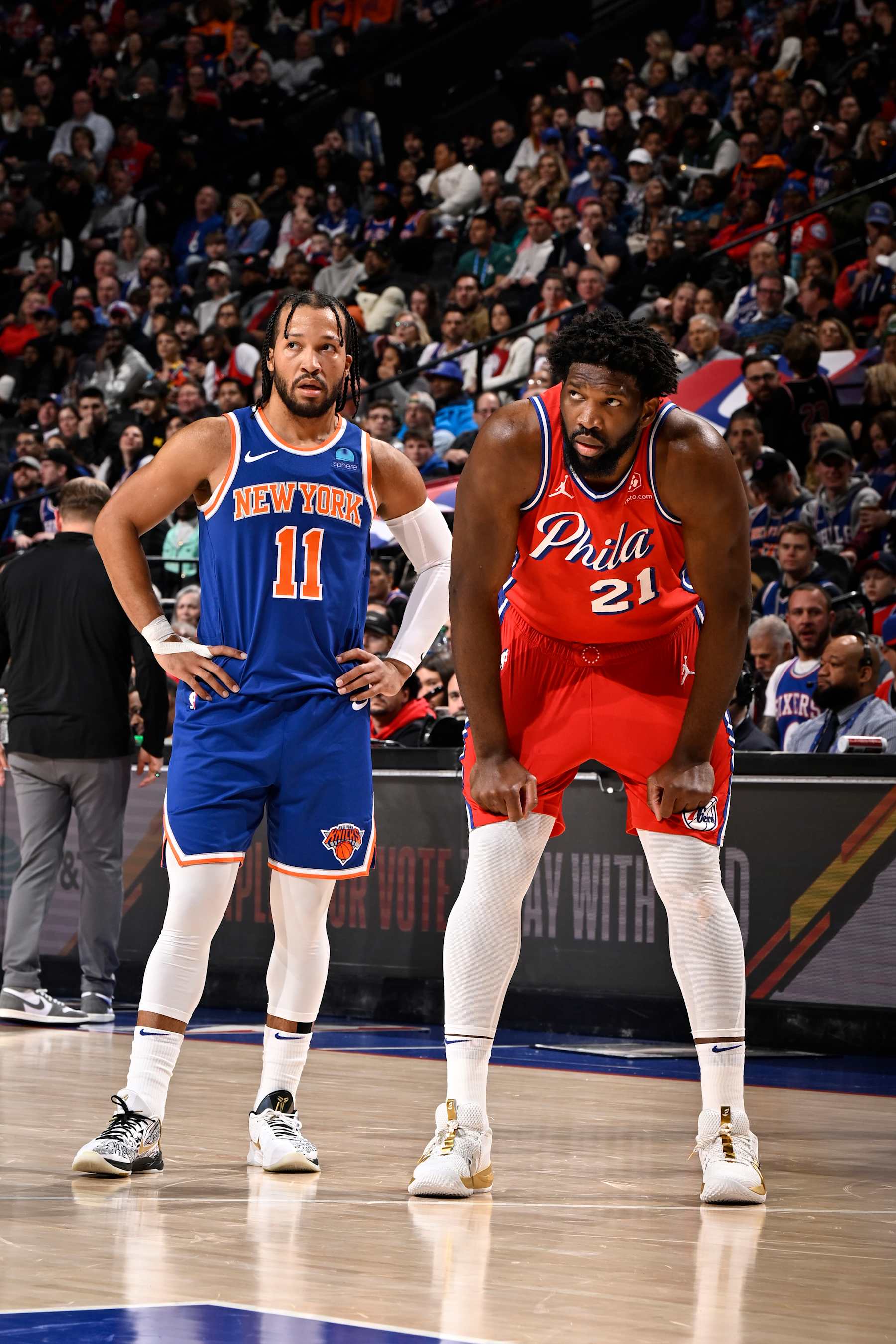 PHILADELPHIA, PA - JANUARY 5:  Jalen Brunson #11 of the New York Knicks and Joel Embiid #21 of the Philadelphia 76ers look on during the game on January 5, 2024 at the Wells Fargo Center in Philadelphia, Pennsylvania NOTE TO USER: User expressly acknowledges and agrees that, by downloading and/or using this Photograph, user is consenting to the terms and conditions of the Getty Images License Agreement. Mandatory Copyright Notice: Copyright 2024 NBAE (Photo by David Dow/NBAE via Getty Images)