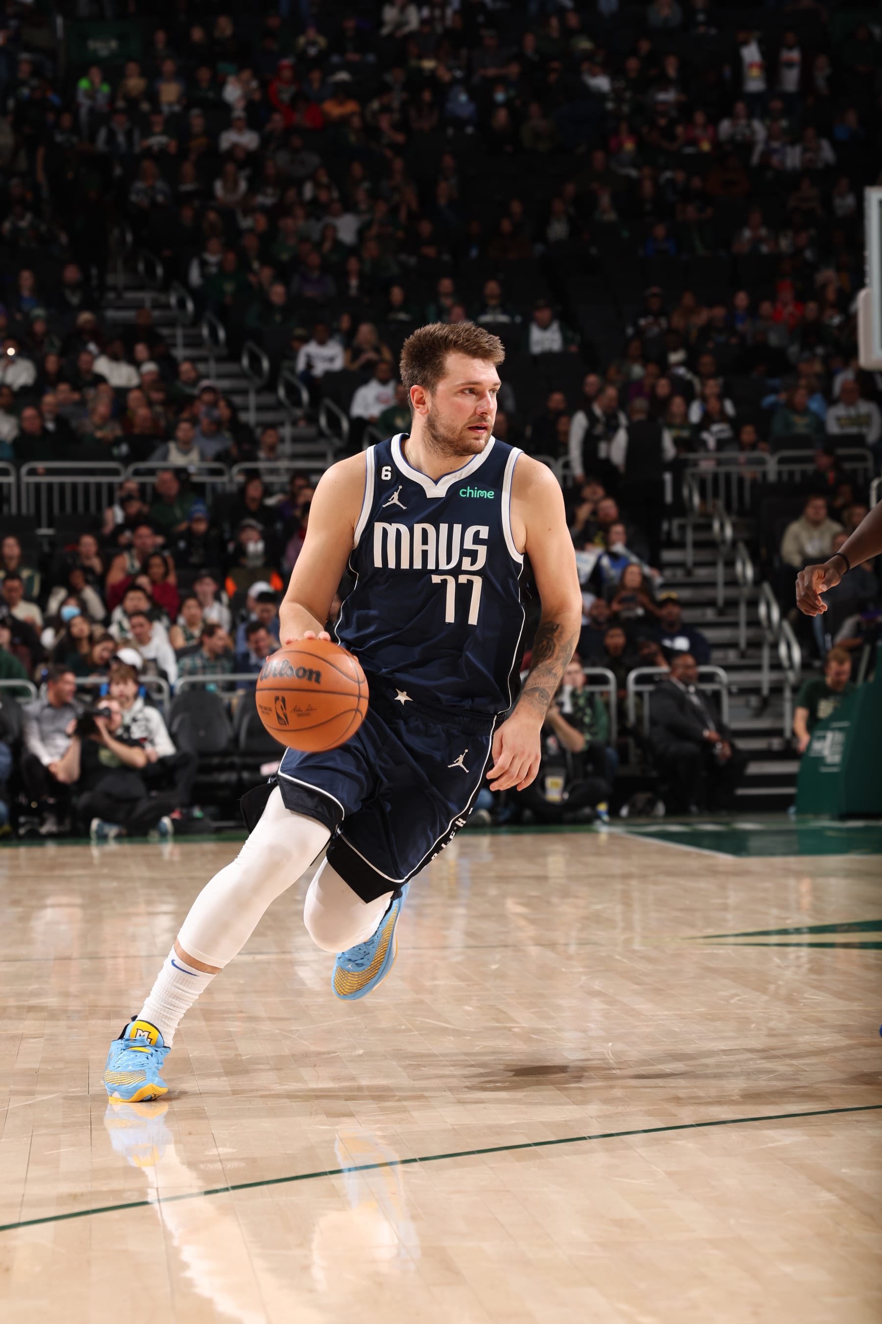 MILWAUKEE, WI - NOVEMBER 27:  Luka Doncic #77 of the Dallas Mavericks handles the ball during the game against the Milwaukee Bucks on November 27, 2022 at the Fiserv Forum Center in Milwaukee, Wisconsin. NOTE TO USER: User expressly acknowledges and agrees that, by downloading and or using this Photograph, user is consenting to the terms and conditions of the Getty Images License Agreement. Mandatory Copyright Notice: Copyright 2022 NBAE (Photo by Jeff Haynes/NBAE via Getty Images).