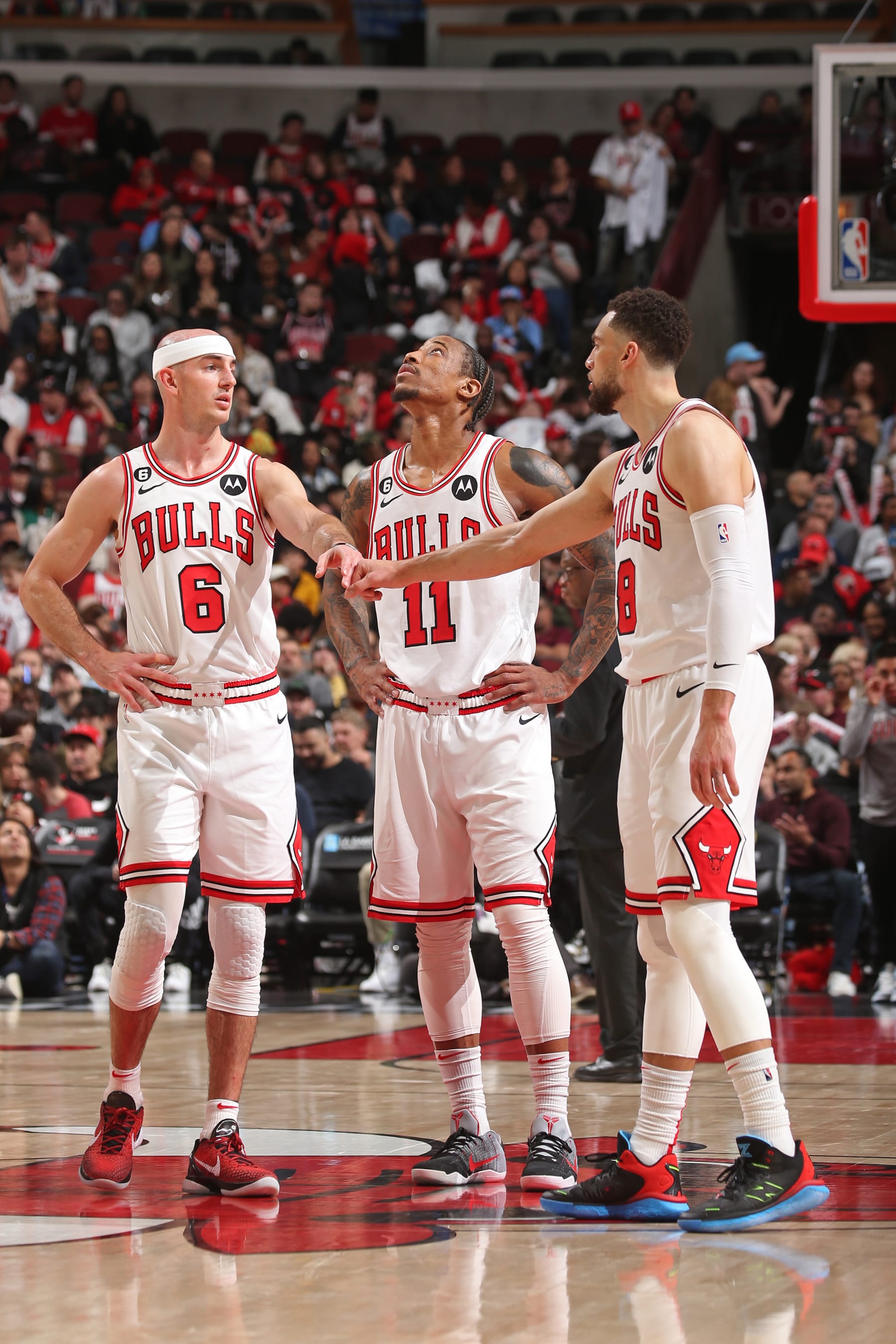 CHICAGO, IL - MARCH 5: Alex Caruso #6, DeMar DeRozan #11, and Zach LaVine #8 of the Chicago Bulls talk during the game against the Indiana Pacers on March 5, 2023 at the United Center in Chicago, Illinois. NOTE TO USER: User expressly acknowledges and agrees that, by downloading and or using this Photograph, user is consenting to the terms and conditions of the Getty Images License Agreement. Mandatory Copyright Notice: Copyright 2023 NBAE (Photo by Gary Dineen/NBAE via Getty Images).