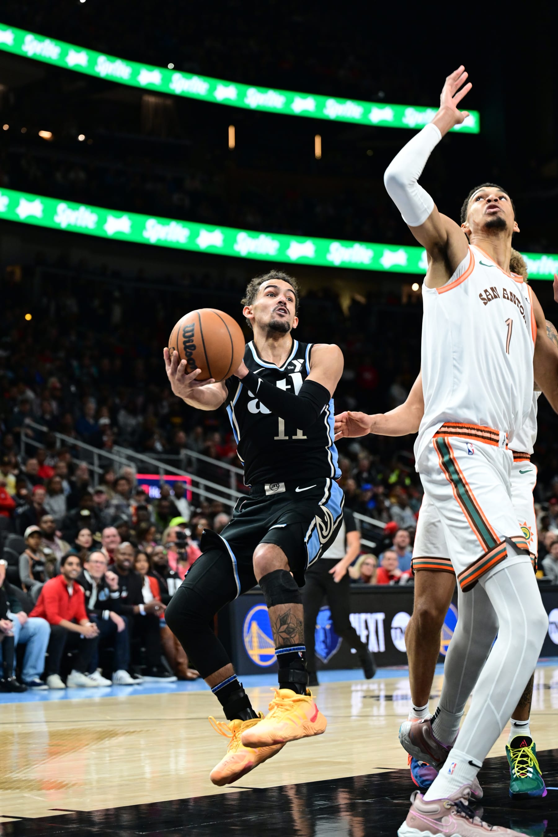 ATLANTA, GA - JANUARY 15: Trae Young #11 of the Atlanta Hawks handles the ball during the game against the San Antonio Spurs on January 15, 2024 at State Farm Arena in Atlanta, Georgia.  NOTE TO USER: User expressly acknowledges and agrees that, by downloading and/or using this Photograph, user is consenting to the terms and conditions of the Getty Images License Agreement. Mandatory Copyright Notice: Copyright 2024 NBAE (Photo by Adam Hagy/NBAE via Getty Images)
