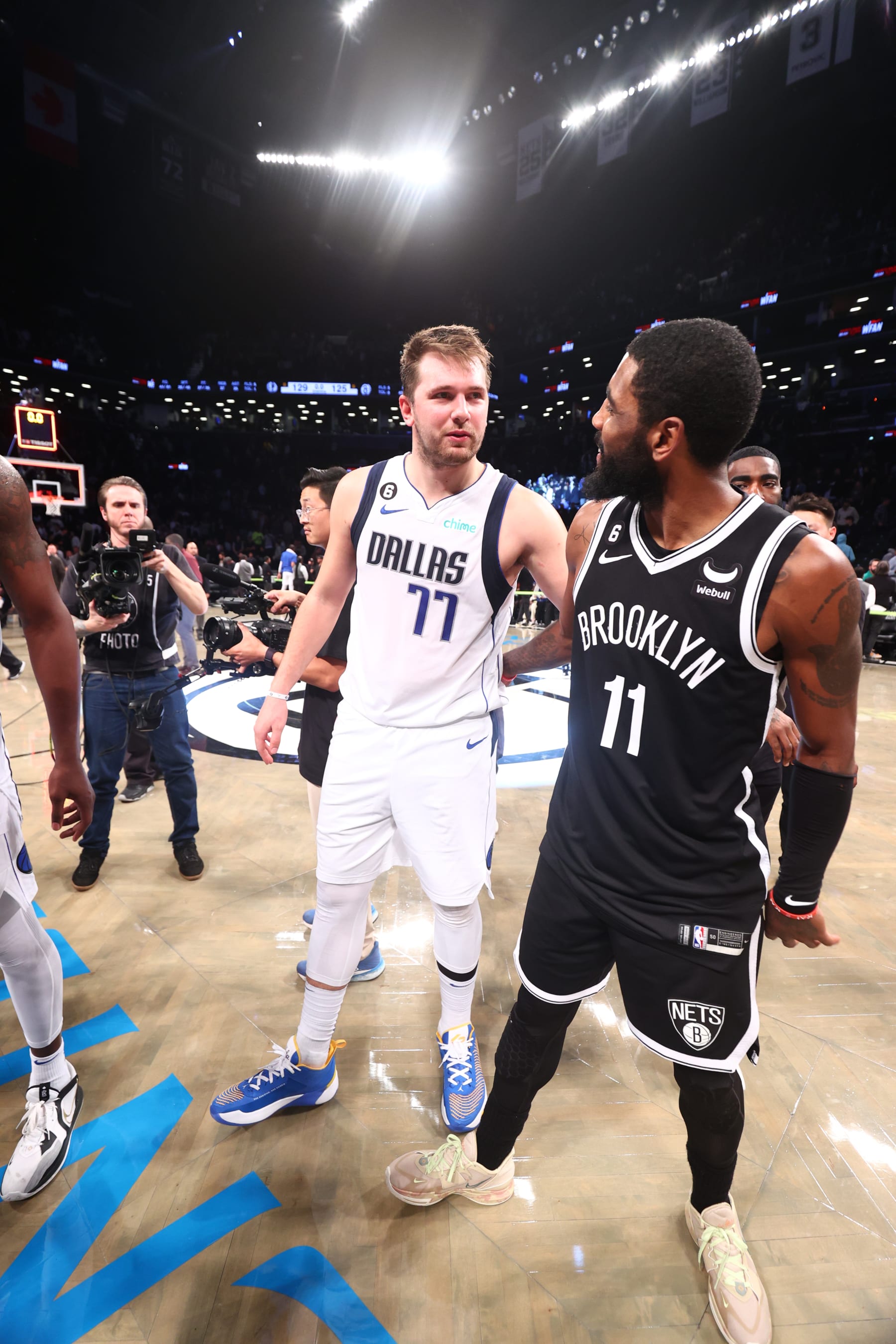 BROOKLYN, NY - OCTOBER 27: Luka Doncic #77 of the Dallas Mavericks embraces Kyrie Irving #11 of the Brooklyn Nets after the game on October 27, 2022 at Barclays Center in Brooklyn, New York. NOTE TO USER: User expressly acknowledges and agrees that, by downloading and or using this Photograph, user is consenting to the terms and conditions of the Getty Images License Agreement. Mandatory Copyright Notice: Copyright 2022 NBAE (Photo by Nathaniel S. Butler/NBAE via Getty Images)