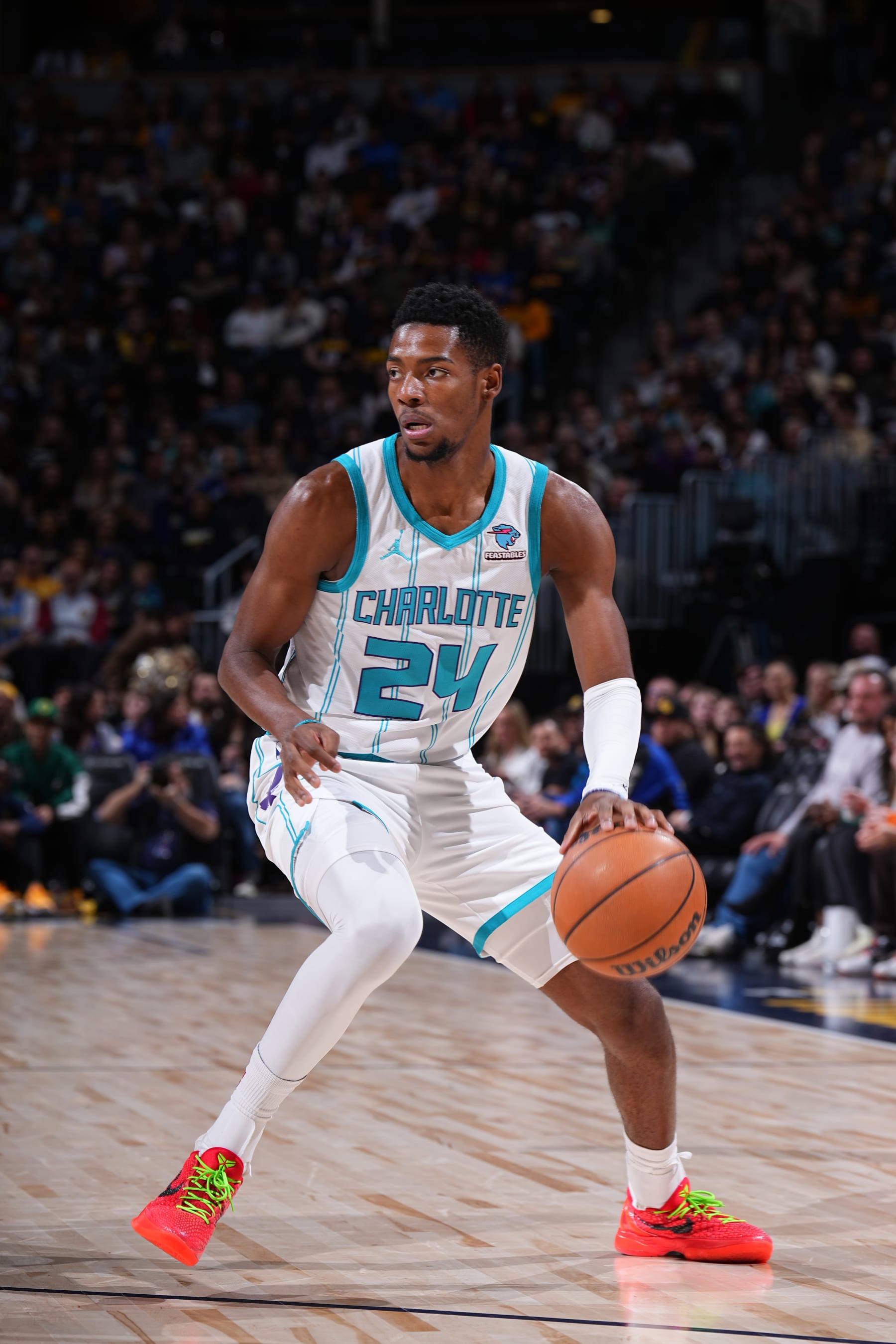 DENVER, CO - JANUARY 1: Brandon Miller #24 of the Charlotte Hornets handles the ball during the game against the Denver Nuggets on January 1, 2024 at the Ball Arena in Denver, Colorado. NOTE TO USER: User expressly acknowledges and agrees that, by downloading and/or using this Photograph, user is consenting to the terms and conditions of the Getty Images License Agreement. Mandatory Copyright Notice: Copyright 2024 NBAE (Photo by Garrett Ellwood/NBAE via Getty Images)
