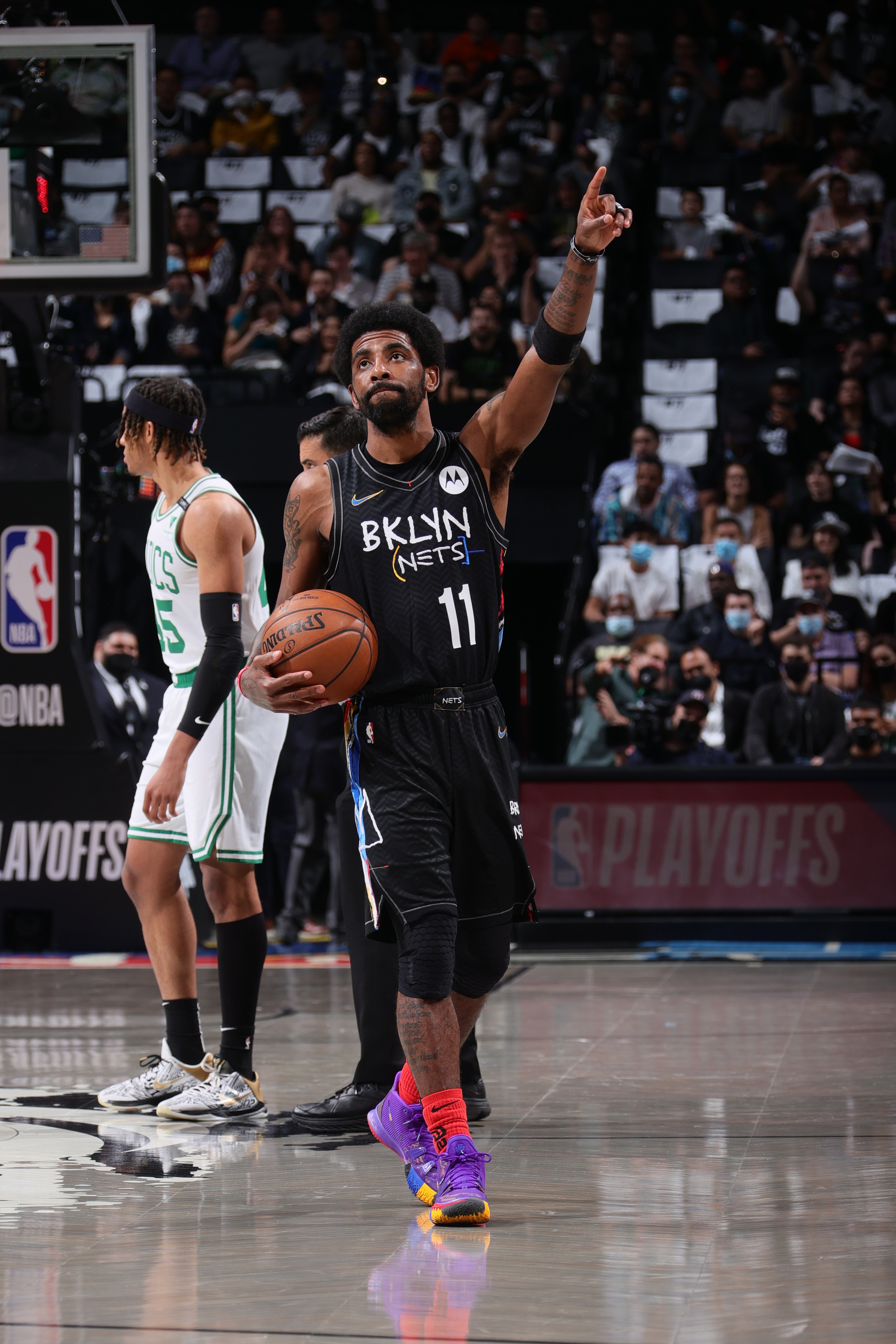 BROOKLYN, NY - JUNE 1: Kyrie Irving #11 of the Brooklyn Nets points up before the game against the Boston Celtics during Round 1, Game 5 of the 2021 NBA Playoffs on June 1, 2021 at Barclays Center in Brooklyn, New York. NOTE TO USER: User expressly acknowledges and agrees that, by downloading and or using this Photograph, user is consenting to the terms and conditions of the Getty Images License Agreement. Mandatory Copyright Notice: Copyright 2021 NBAE (Photo by Nathaniel S. Butler/NBAE via Getty Images)