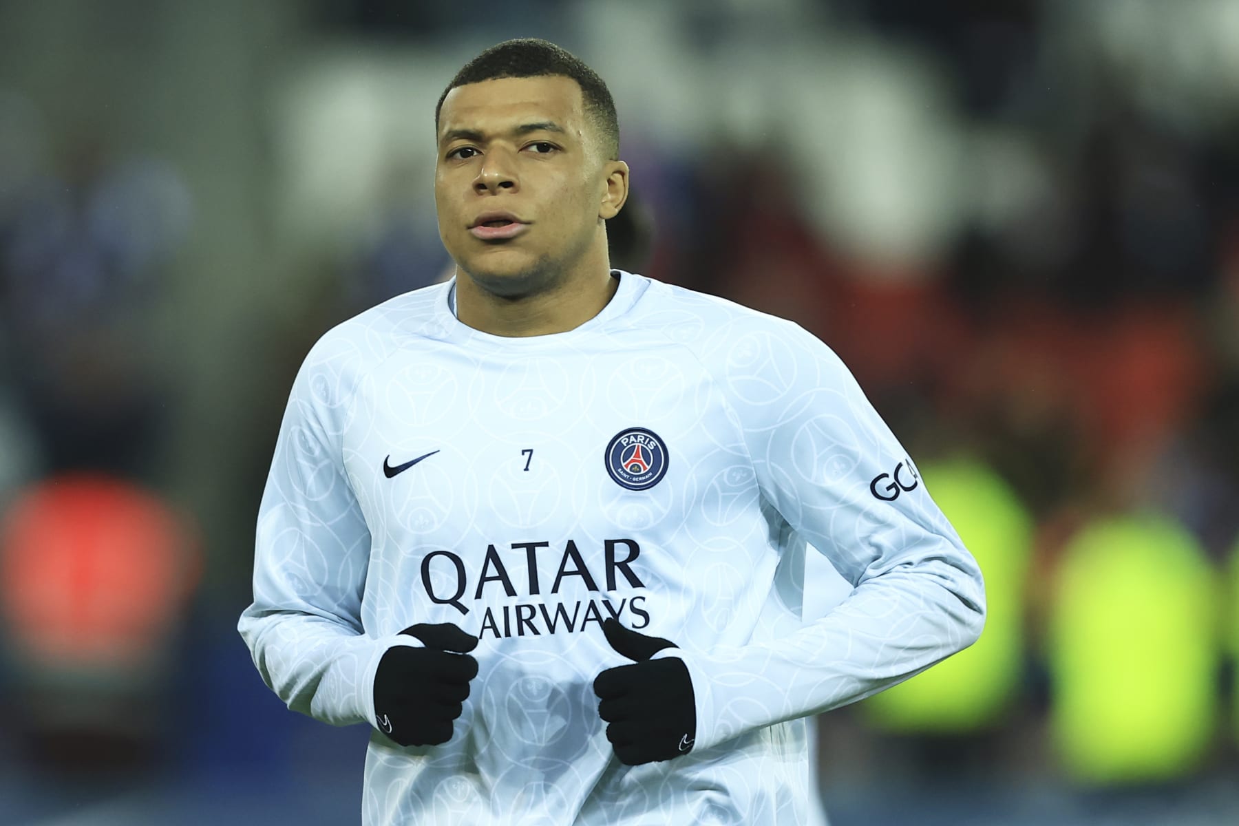 PSG's Kylian Mbappe warms up before the French League One soccer match between Paris Saint-Germain and Lyon at the Parc des Princes stadium in Paris, Sunday, April 2, 2023. (AP Photo/Aurelien Morissard)