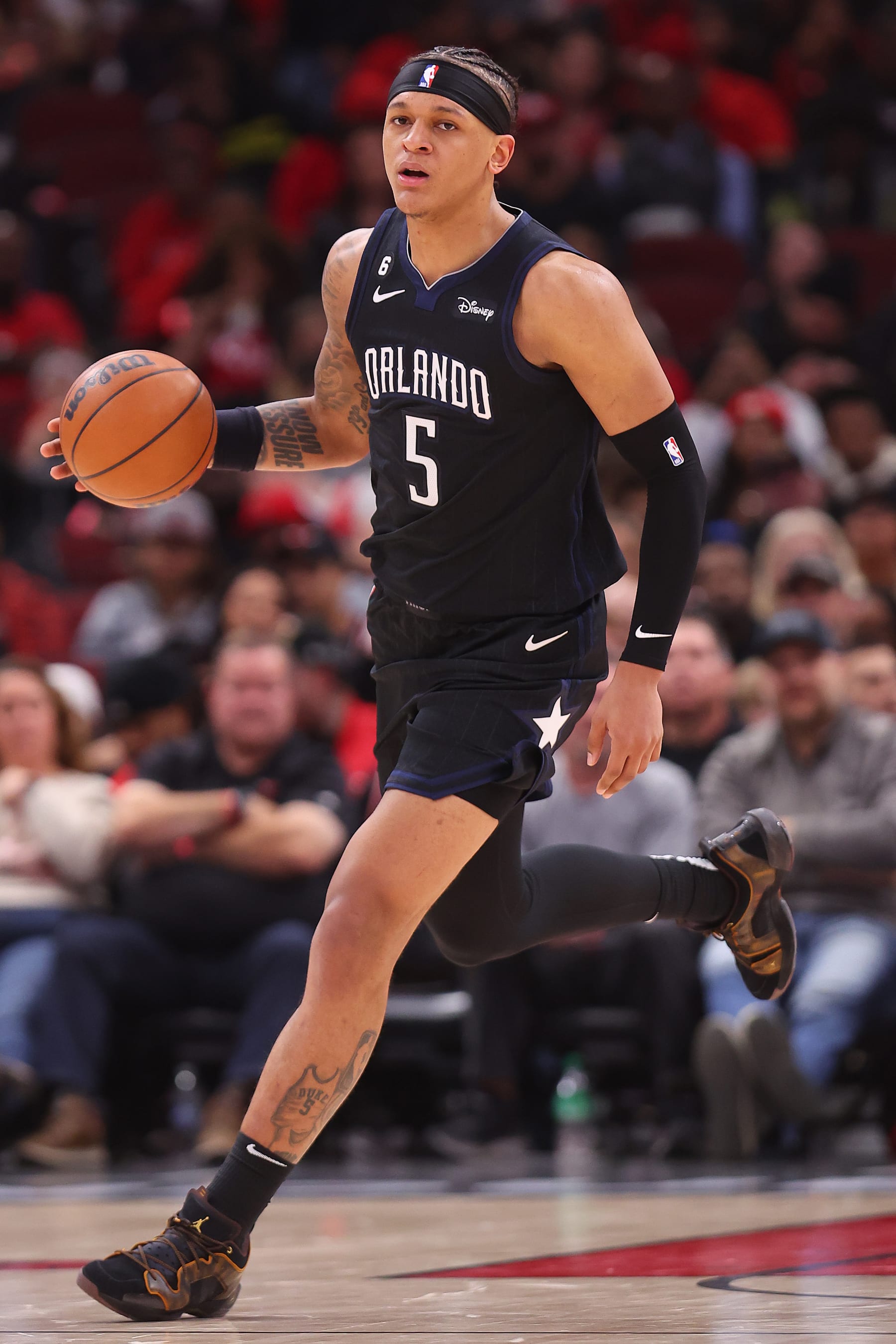 CHICAGO, ILLINOIS - FEBRUARY 13: Paolo Banchero #5 of the Orlando Magic in action against the Chicago Bulls during the first half at United Center on February 13, 2023 in Chicago, Illinois. NOTE TO USER: User expressly acknowledges and agrees that, by downloading and or using this photograph, User is consenting to the terms and conditions of the Getty Images License Agreement.  (Photo by Michael Reaves/Getty Images)