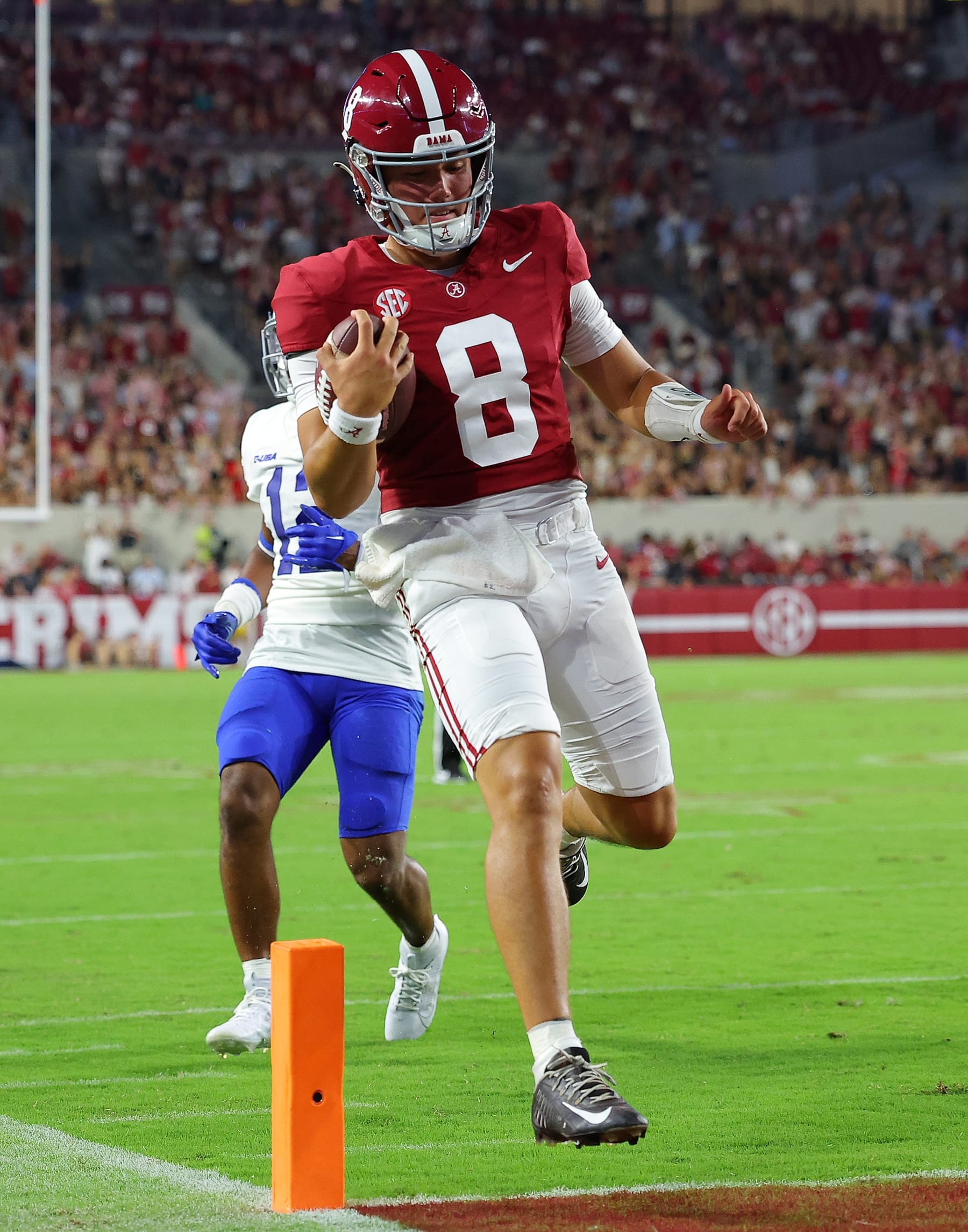 TUSCALOOSA, ALABAMA - SEPTEMBER 02: Tyler Buchner #8 of the Alabama Crimson Tide rushes for a touchdown against Jalen Davis #12 of the Middle Tennessee Blue Raiders during the fourth quarter at Bryant-Denny Stadium on September 02, 2023 in Tuscaloosa, Alabama. (Photo by Kevin C. Cox/Getty Images) TUSCALOOSA, ALABAMA - SEPTEMBER 02: Tyler Buchner #8 of the Alabama Crimson Tide rushes for a touchdown against Jalen Davis #12 of the Middle Tennessee Blue Raiders during the fourth quarter at Bryant-Denny Stadium on September 02, 2023 in Tuscaloosa, Alabama. (Photo by Kevin C. Cox/Getty Images)