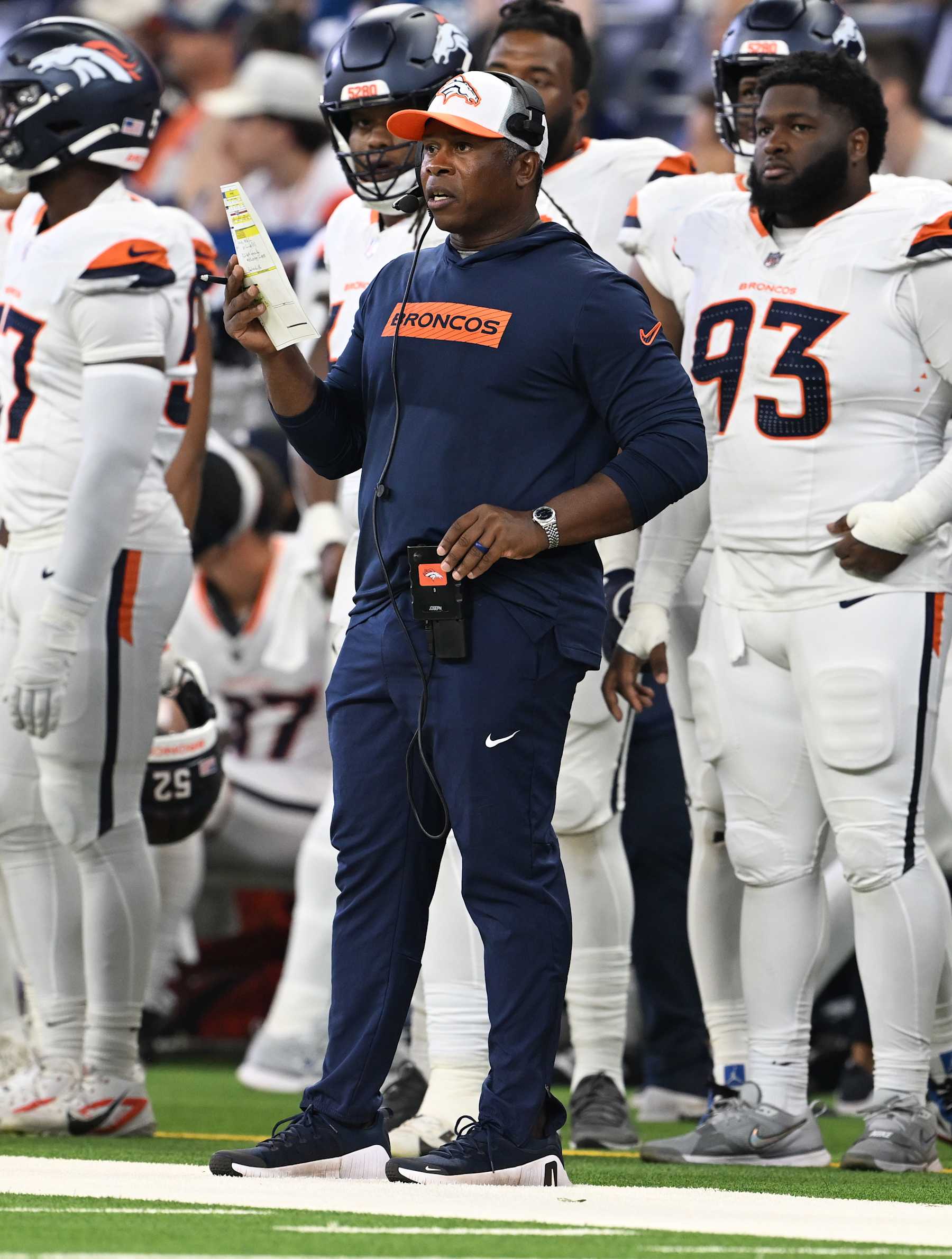 INDIANAPOLIS, INDIANA - AUGUST 11: Denver Broncos defensive coordinator Vance Joseph watches the action on the field at Lucas Oil Stadium in Indianapolis, Indiana on August 11, 2024. The Indianapolis Colts lost 34 to 30 against the Denver Broncos during the first NFL Preseason game of the 2024 summer for the two teams. (Photo by RJ Sangosti/The Denver Post)