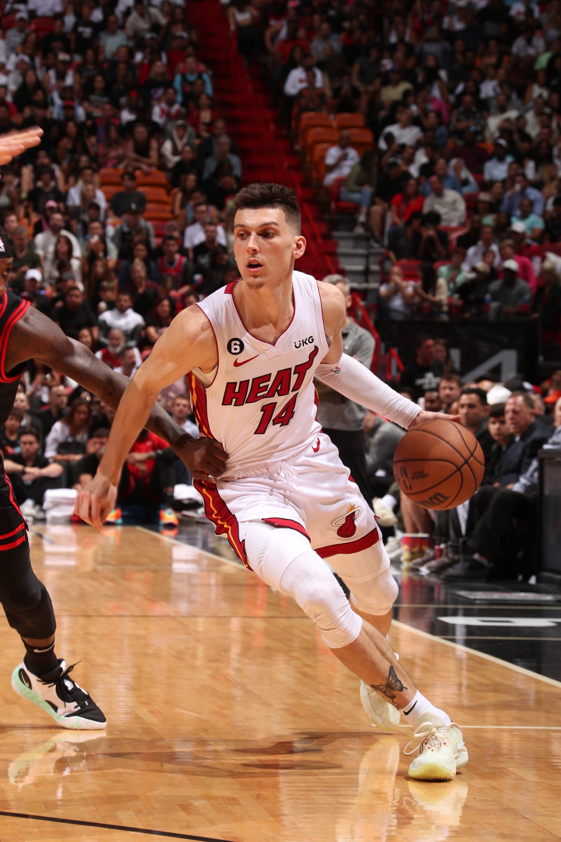 MIAMI, FL - APRIL 14: Tyler Herro #14 of the Miami Heat dribbles the ball against the Chicago Bulls during the 2023 Play-In Tournament on April 14, 2023 at the Kaseya Center in Miami, Florida. NOTE TO USER: User expressly acknowledges and agrees that, by downloading and or using this Photograph, user is consenting to the terms and conditions of the Getty Images License Agreement. Mandatory Copyright Notice: Copyright 2023 NBAE (Photo by Issac Baldizon/NBAE via Getty Images)