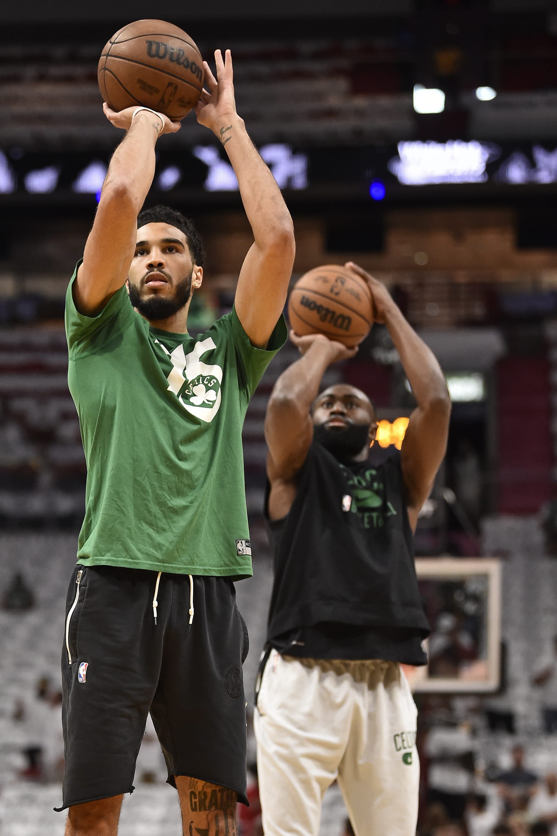MIAMI, FL - MAY 25: Jayson Tatum #0 of the Boston Celtics and Jaylen Brown #7 of the Boston Celtics warms up prior to the game against the Miami Heat during Game 5 of the 2022 NBA Playoffs Eastern Conference Finals on May 25, 2022 at FTX Arena in Miami, Florida. NOTE TO USER: User expressly acknowledges and agrees that, by downloading and or using this Photograph, user is consenting to the terms and conditions of the Getty Images License Agreement. Mandatory Copyright Notice: Copyright 2022 NBAE (Photo by David Dow/NBAE via Getty Images)