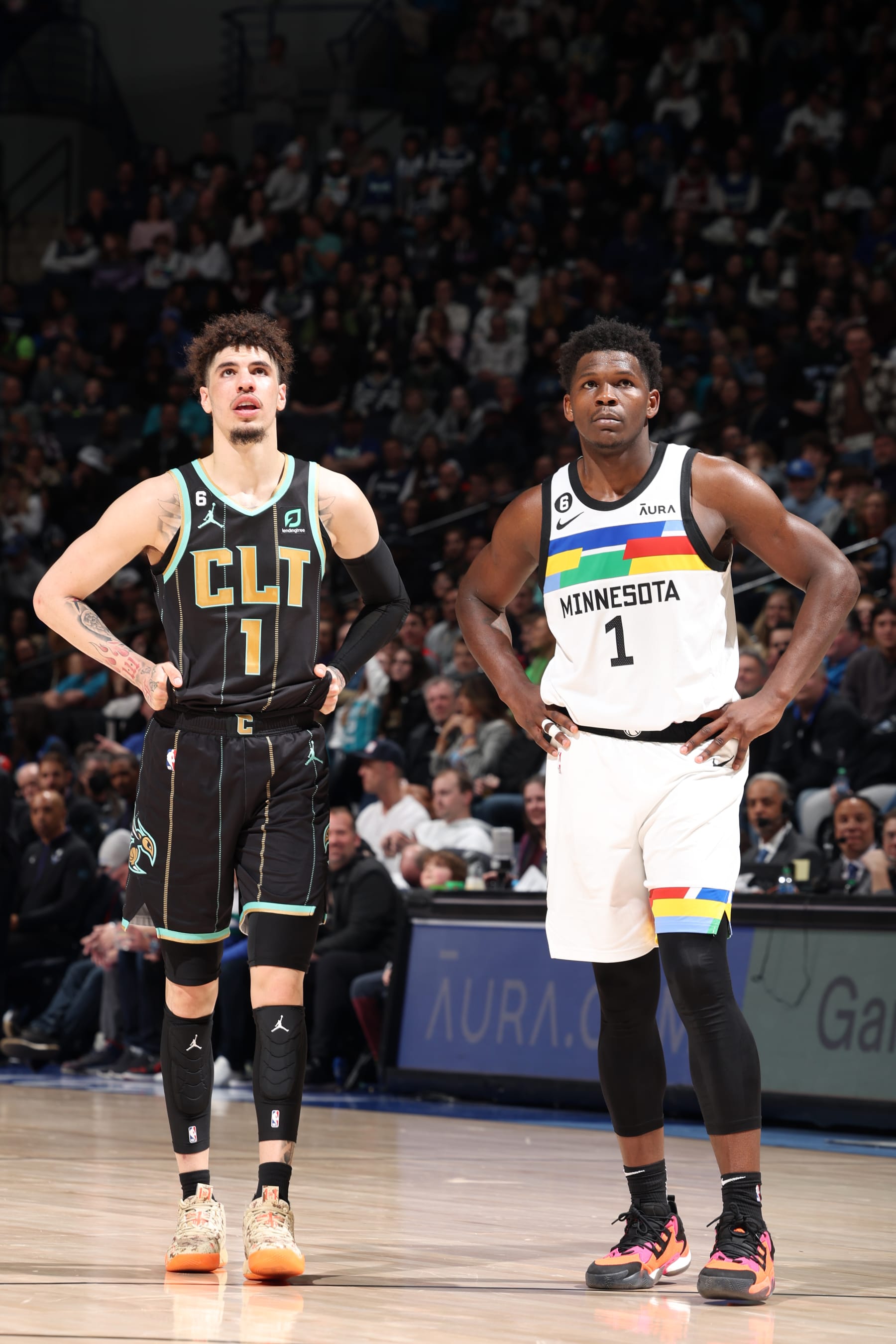 MINNEAPOLIS, MN -  FEBRUARY 24: LaMelo Ball #1 of the Charlotte Hornets and Anthony Edwards #1 of the Minnesota Timberwolves look on during the game on February 24, 2023 at Target Center in Minneapolis, Minnesota. NOTE TO USER: User expressly acknowledges and agrees that, by downloading and or using this Photograph, user is consenting to the terms and conditions of the Getty Images License Agreement. Mandatory Copyright Notice: Copyright 2023 NBAE (Photo by David Sherman/NBAE via Getty Images)