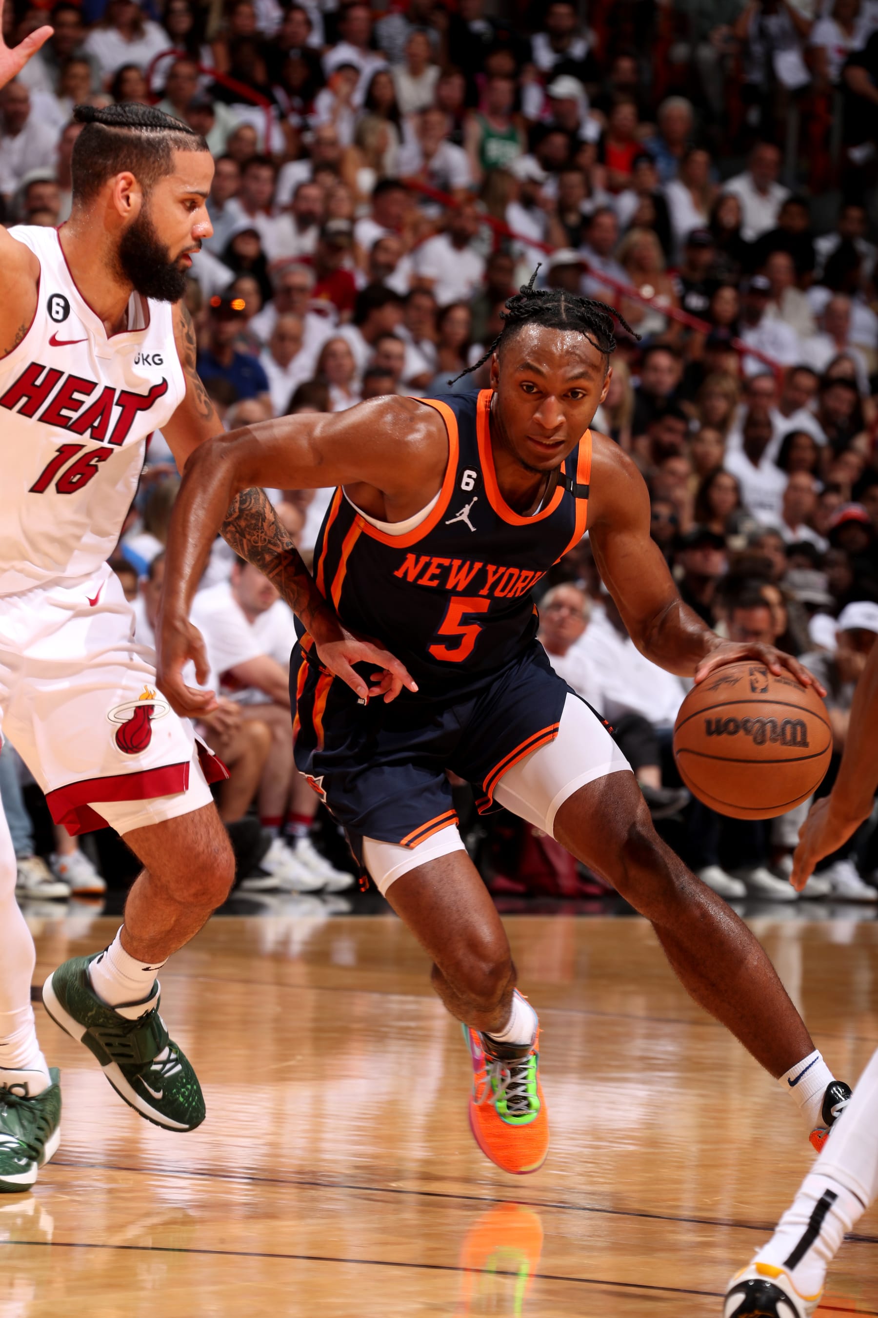 MIAMI, FL - MAY 6: Immanuel Quickley #5 of the New York Knicks handles the ball during the game against the Miami Heat during Game Three of the Eastern Conference Semi-Finals of the 2023 NBA Playoffs on May 6, 2023 at Miami-Dade Arena in Miami, Florida. NOTE TO USER: User expressly acknowledges and agrees that, by downloading and or using this Photograph, user is consenting to the terms and conditions of the Getty Images License Agreement. Mandatory Copyright Notice: Copyright 2023 NBAE (Photo by Issac Baldizon/NBAE via Getty Images)
