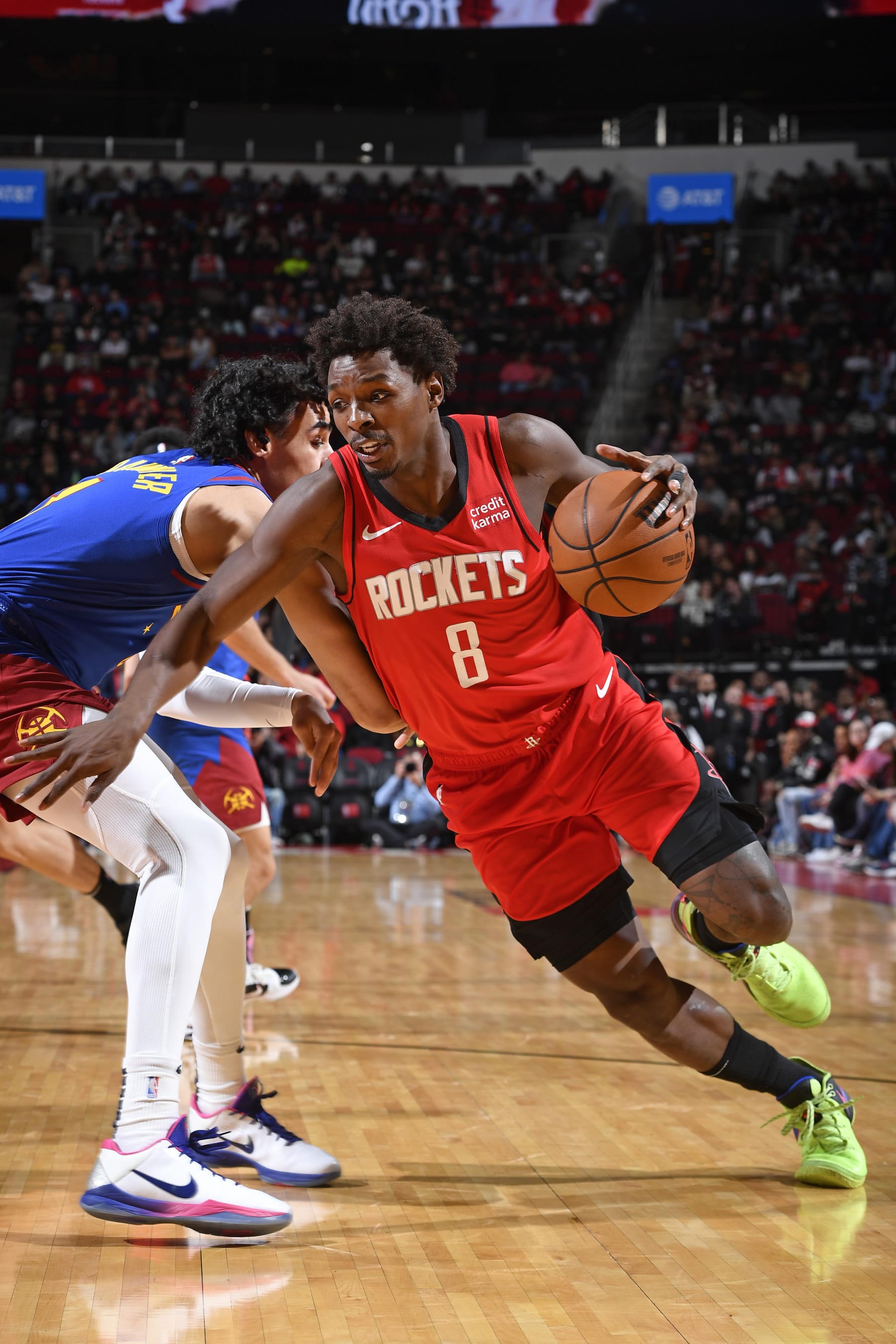 HOUSTON, TX - NOVEMBER 12:  Jae'Sean Tate #8 of the Houston Rockets drives to the basket during the game against the Denver Nuggets on November 12, 2023 at the Toyota Center in Houston, Texas. NOTE TO USER: User expressly acknowledges and agrees that, by downloading and or using this photograph, User is consenting to the terms and conditions of the Getty Images License Agreement. Mandatory Copyright Notice: Copyright 2023 NBAE (Photo by Logan Riely/NBAE via Getty Images)